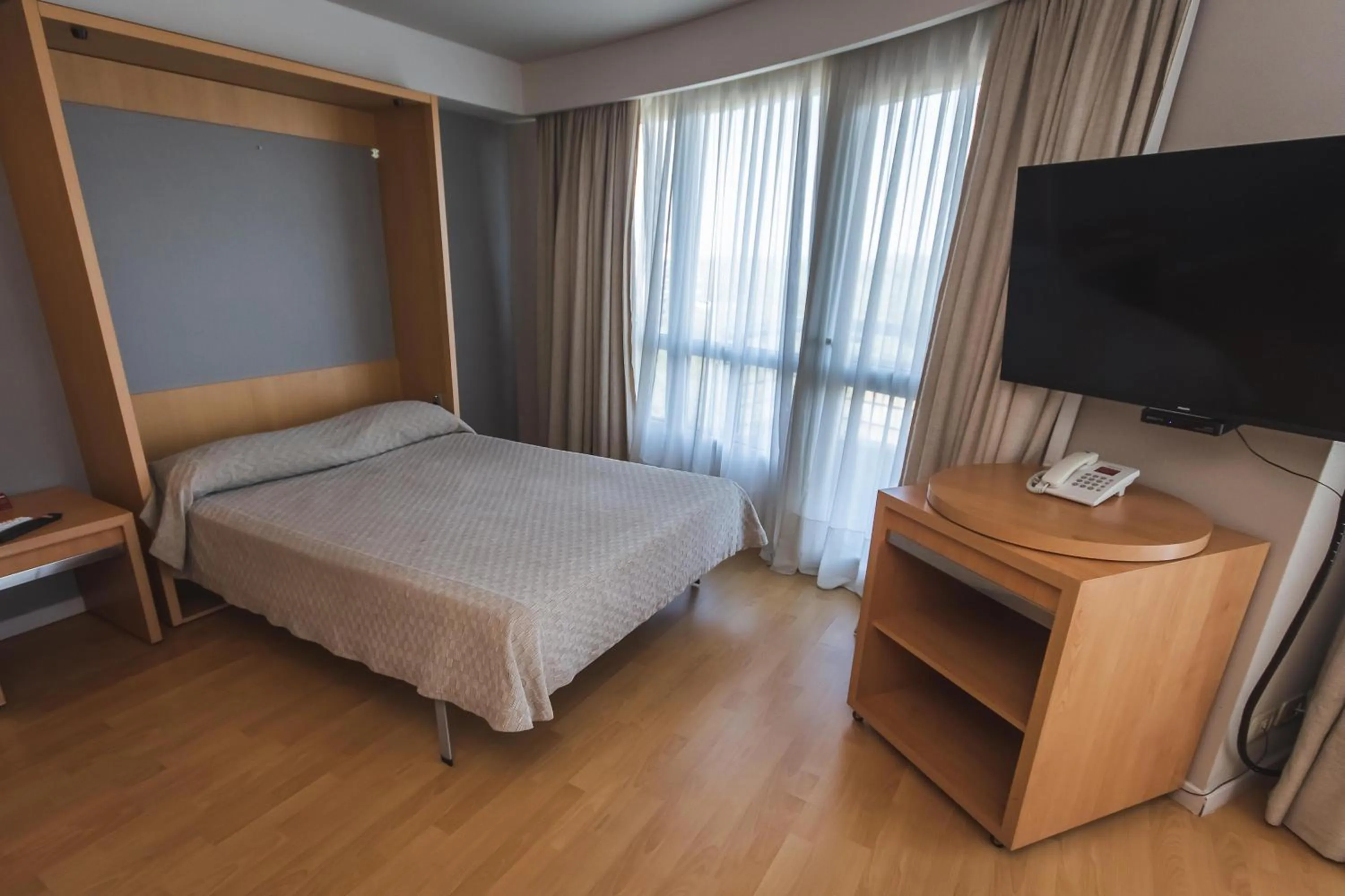 Bed in Maran Suites & Towers