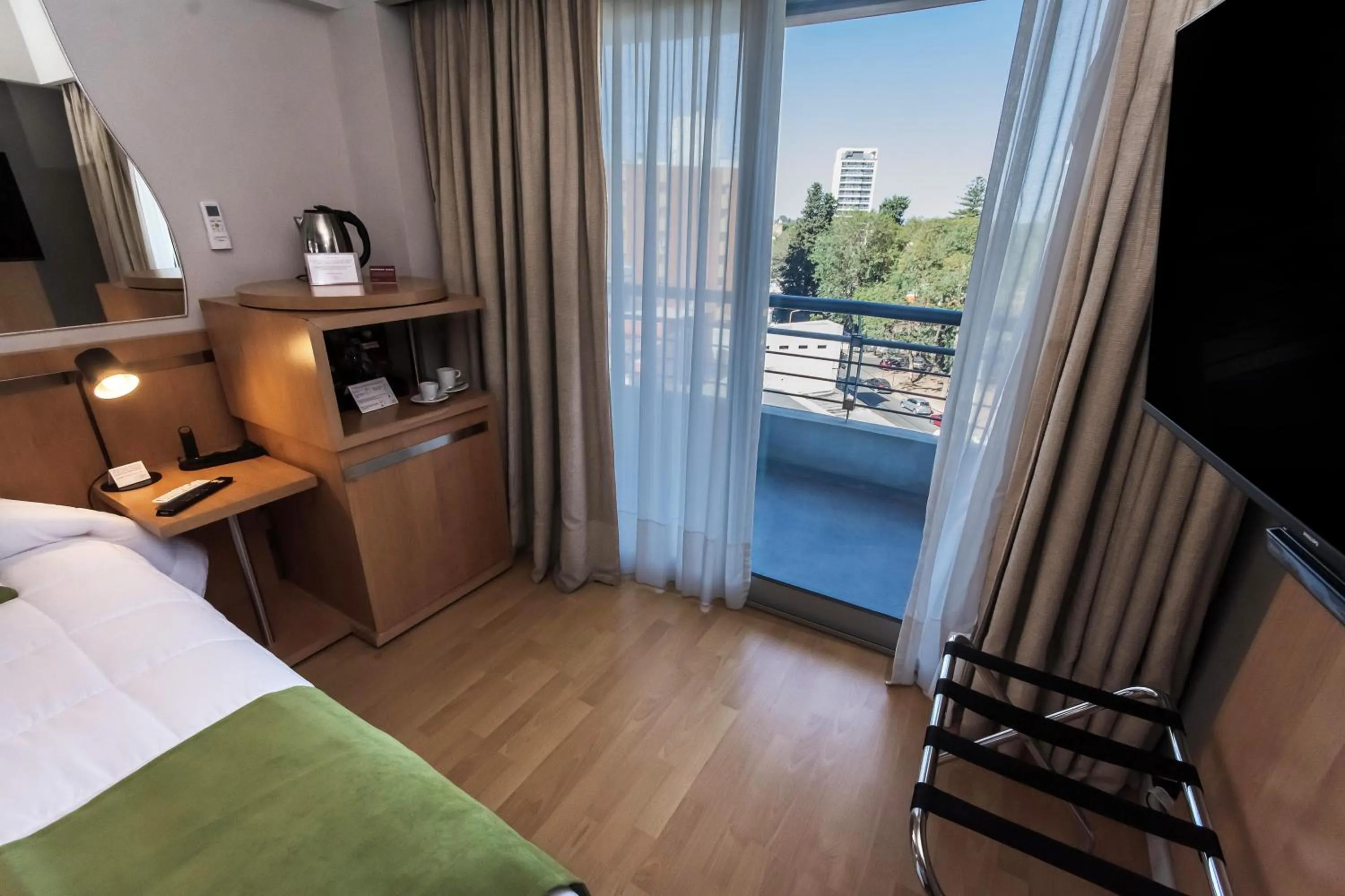 Bed in Maran Suites & Towers