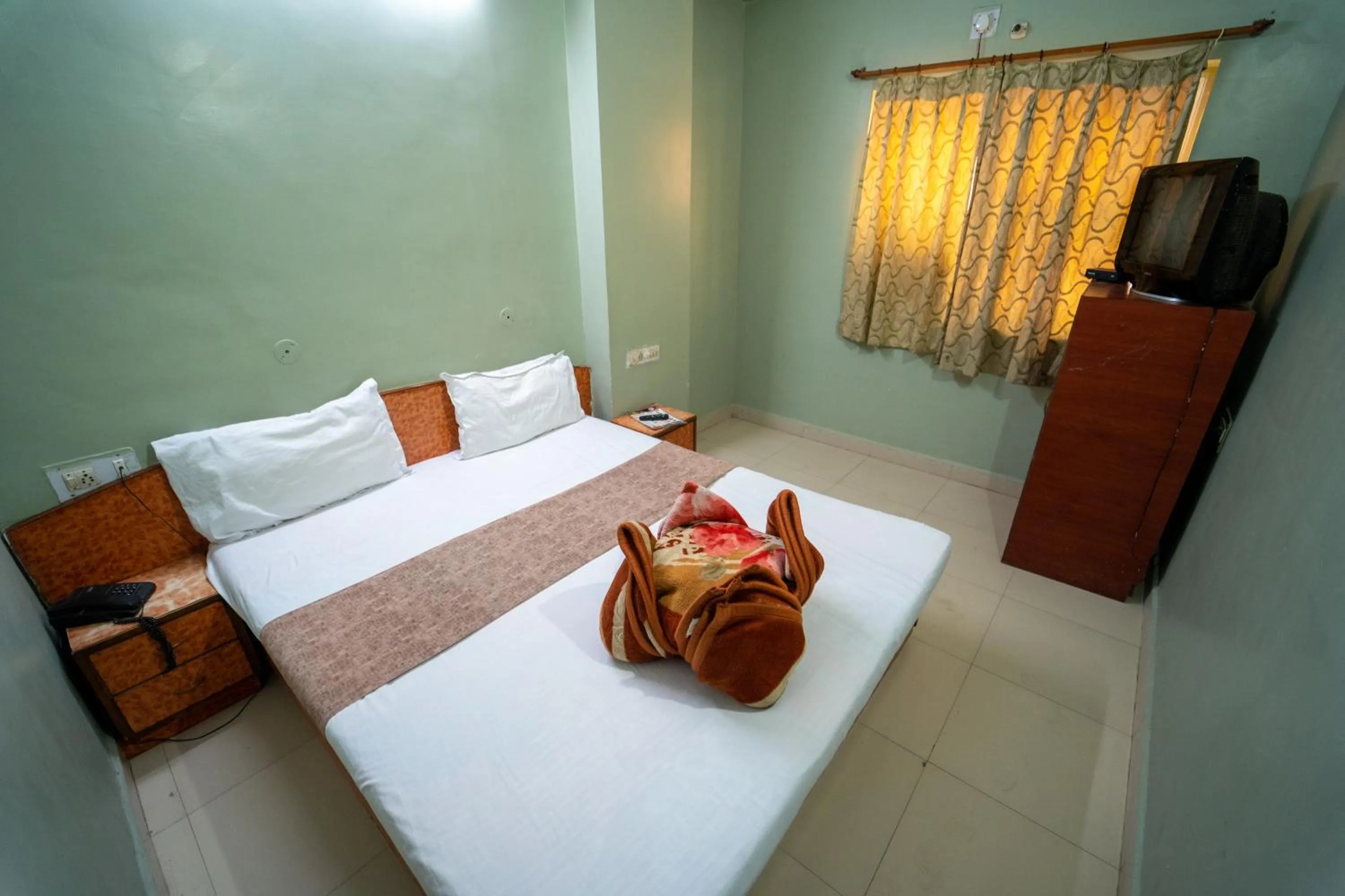Bed in Hotel Siddhi Vinayak