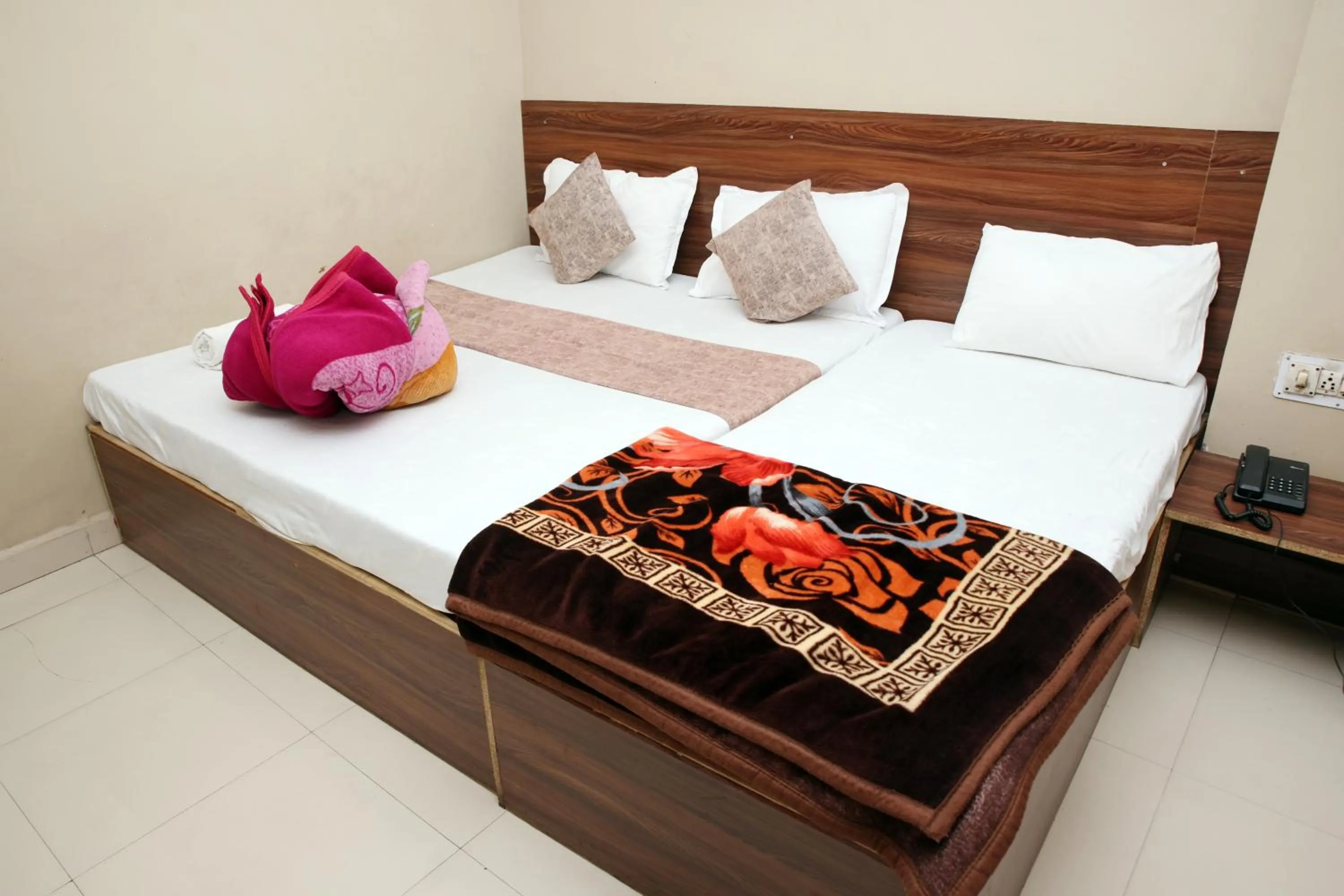 Bed in Hotel Siddhi Vinayak