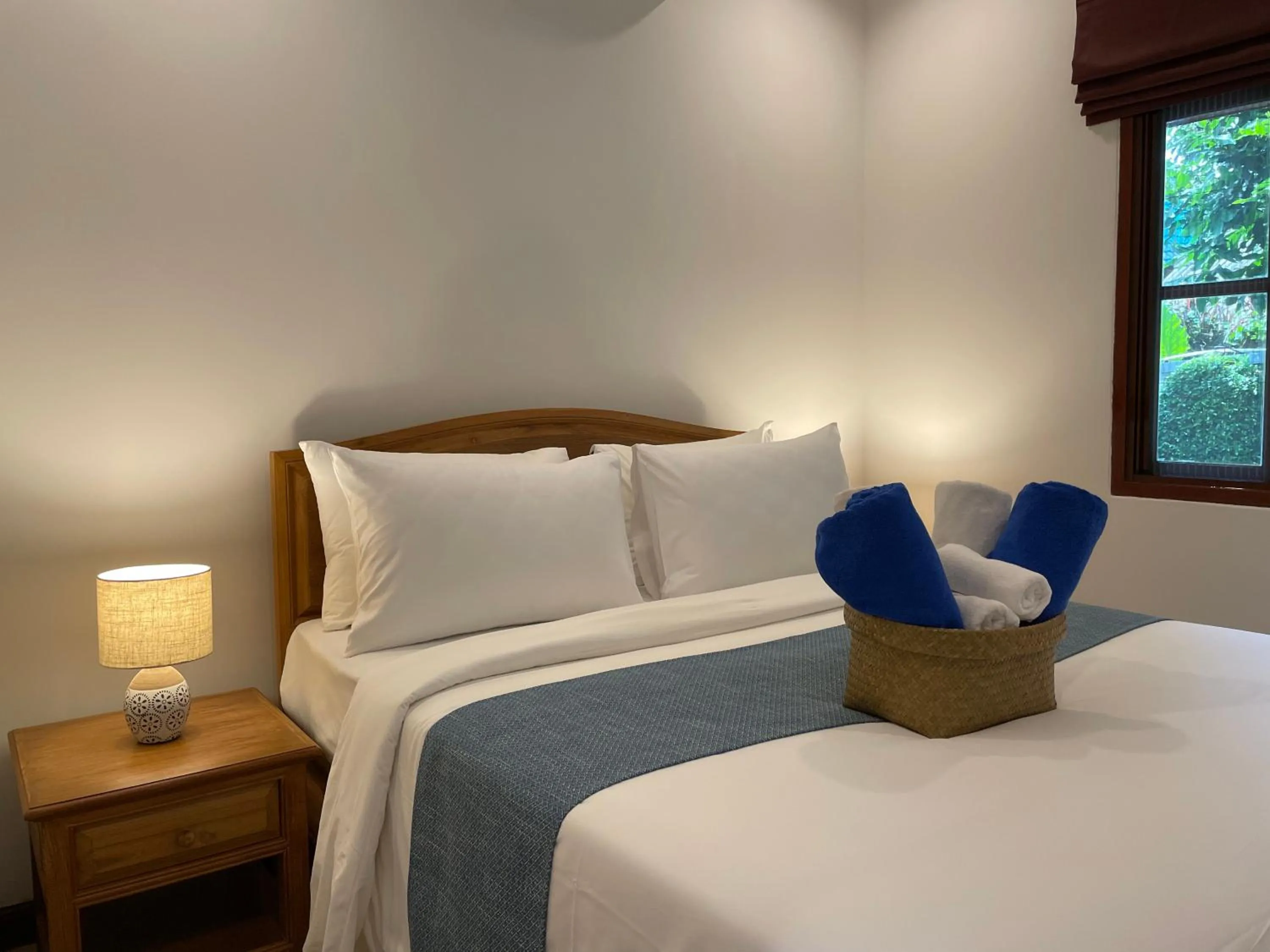 Bed in The Pace Phuket Boutique Resort