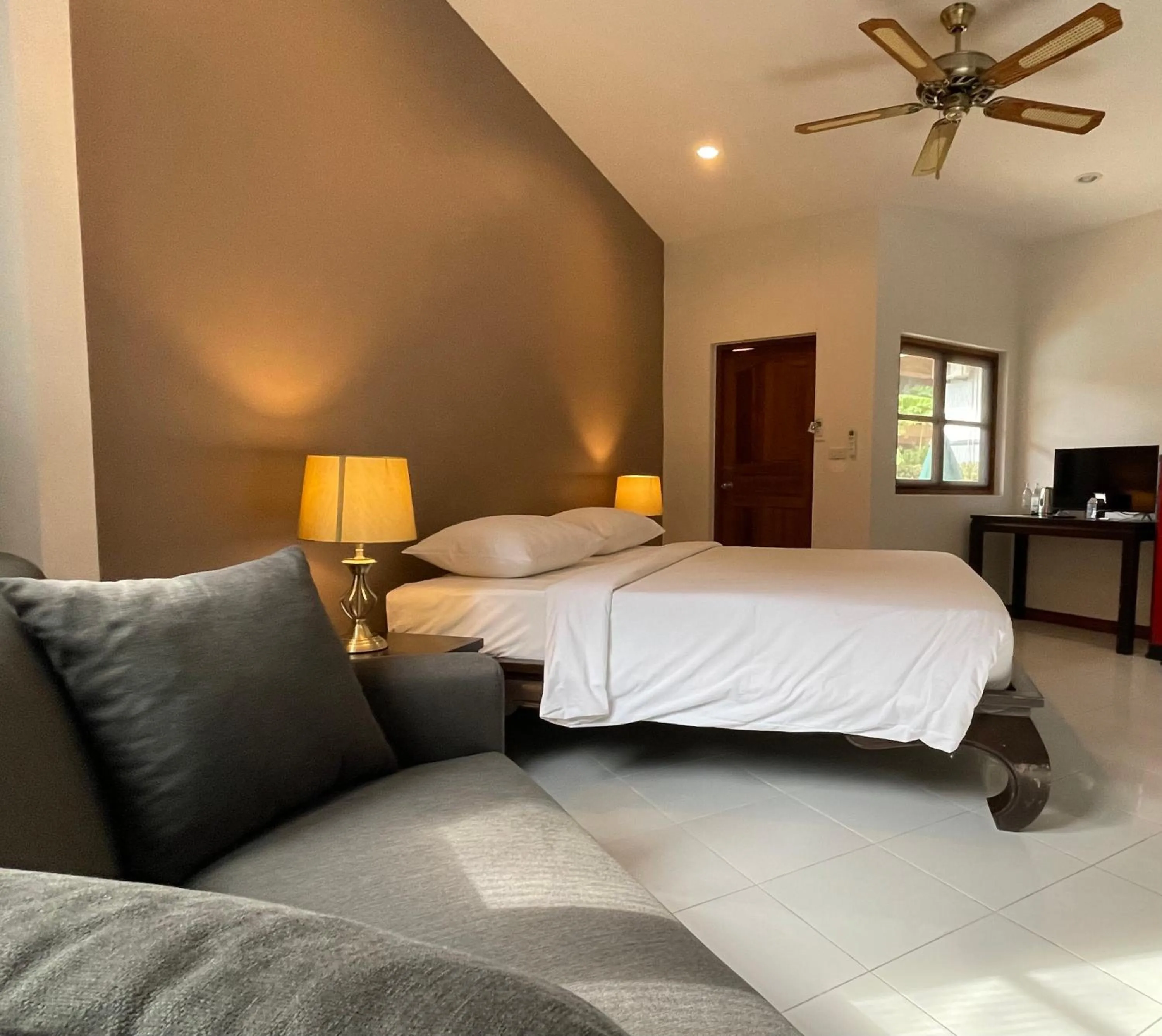 Bed in The Pace Phuket Boutique Resort