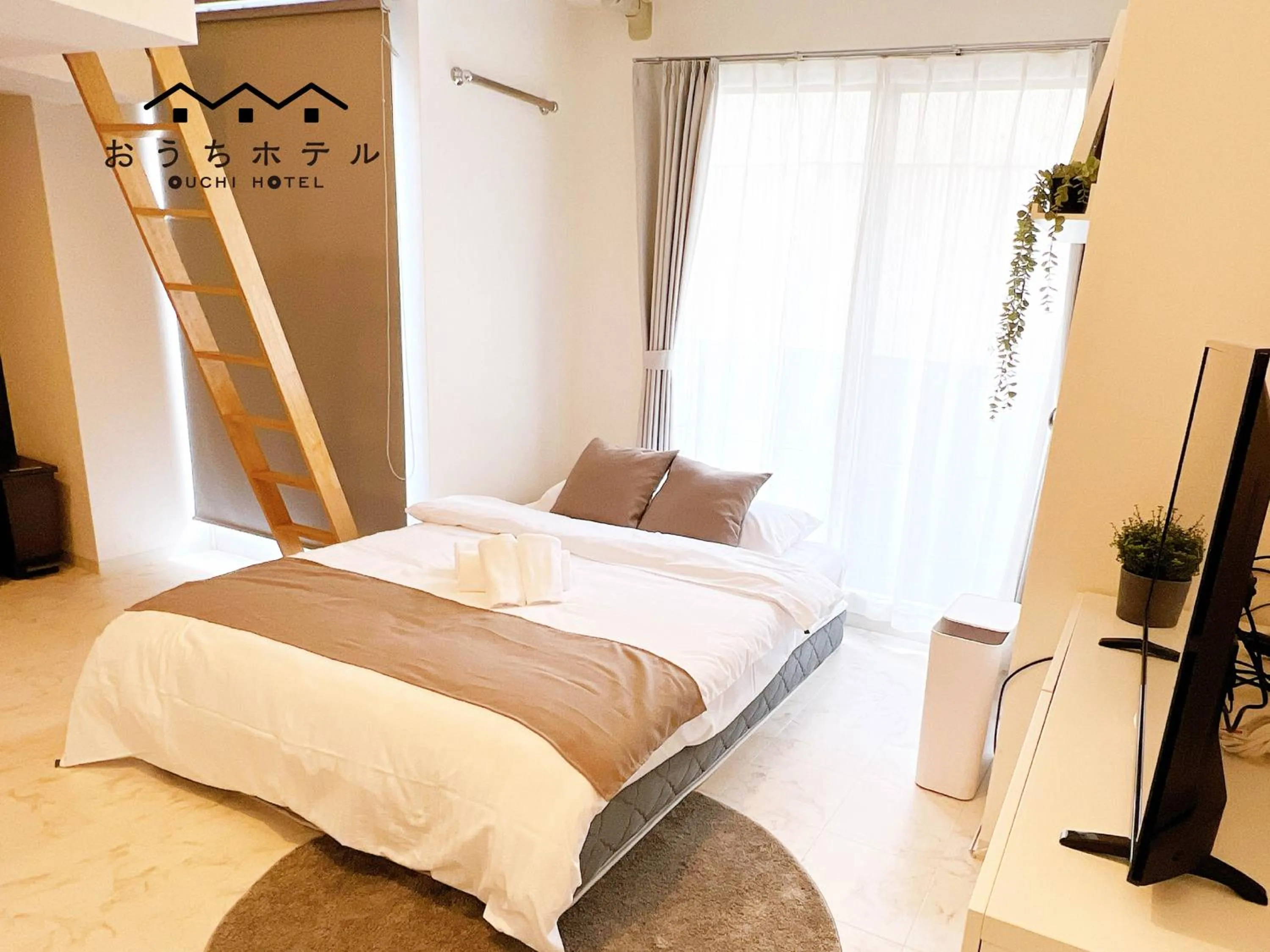 Bed in OUCHI HOTEL Fujimi