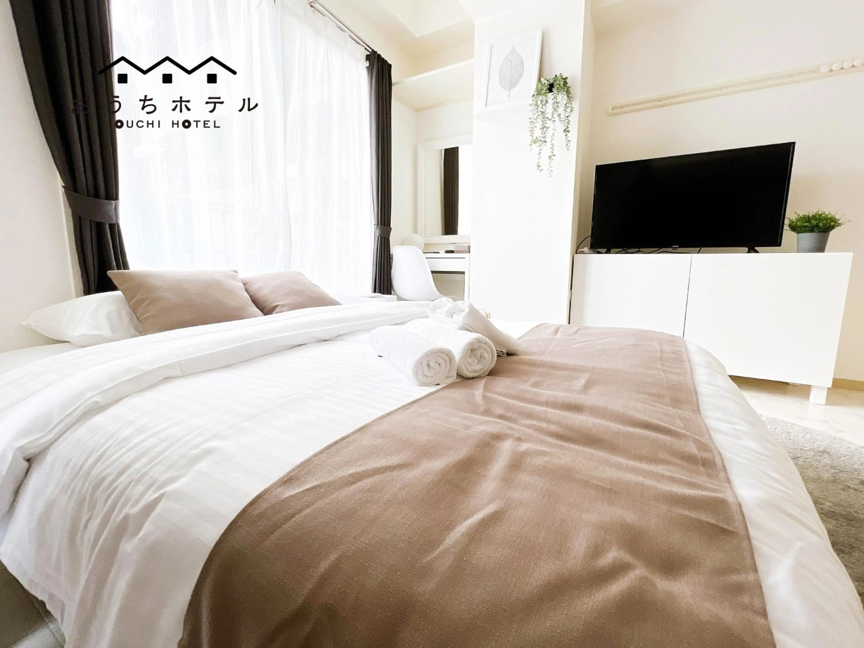 Bed in OUCHI HOTEL Fujimi