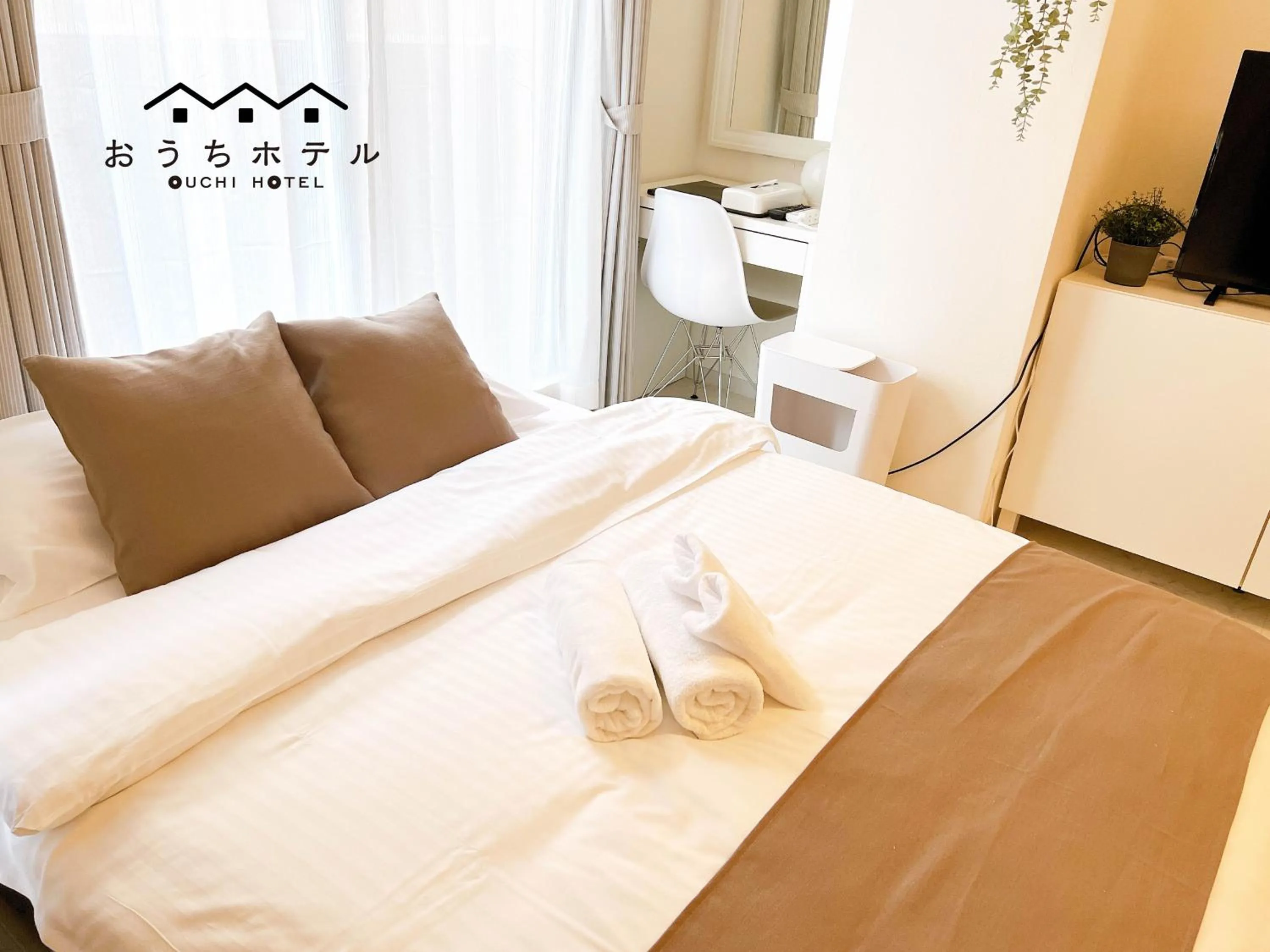 Bed in OUCHI HOTEL Fujimi