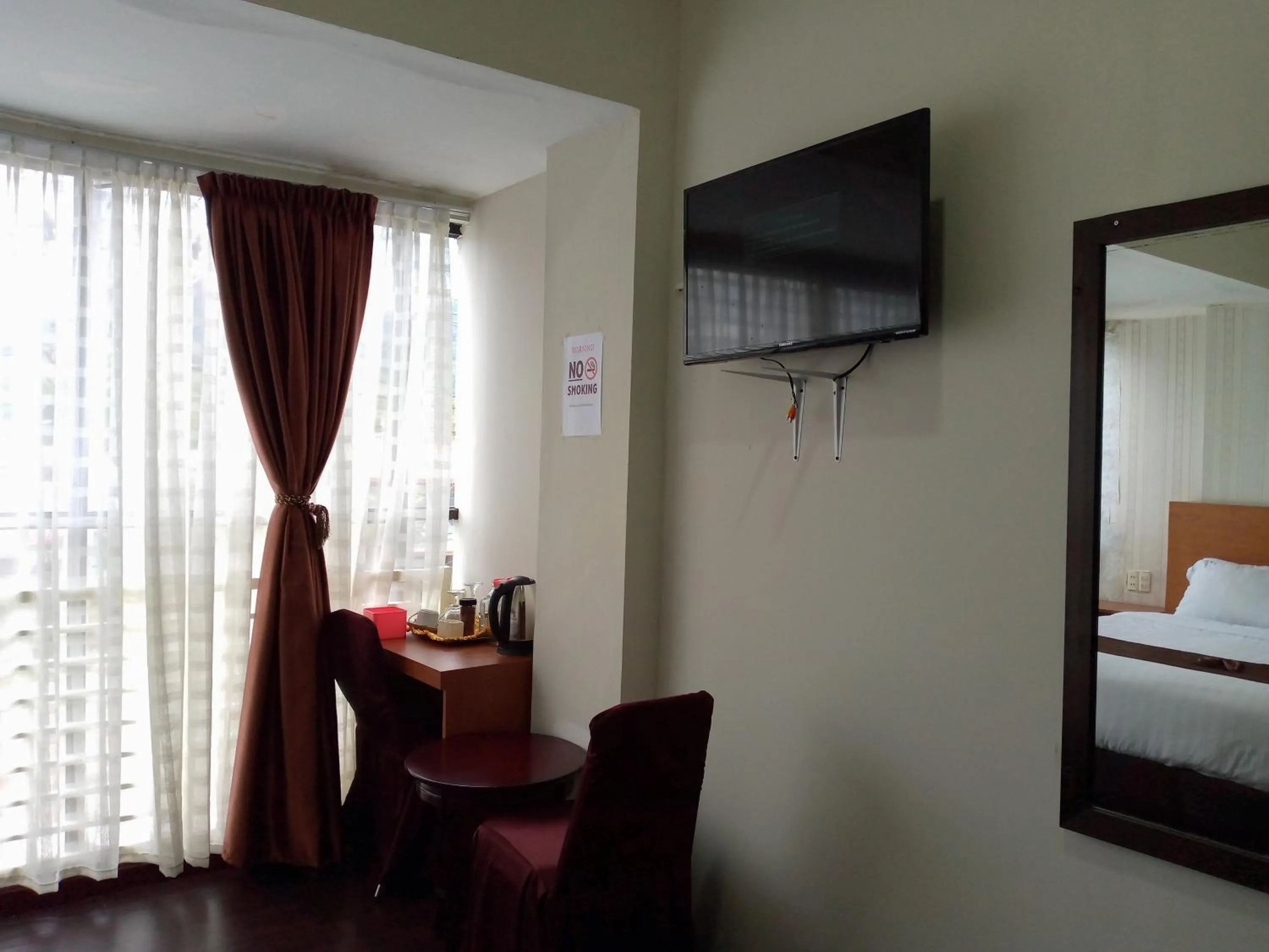 Bed in Hotel Belangi Syariah Taakengon Mitra RedDoorz