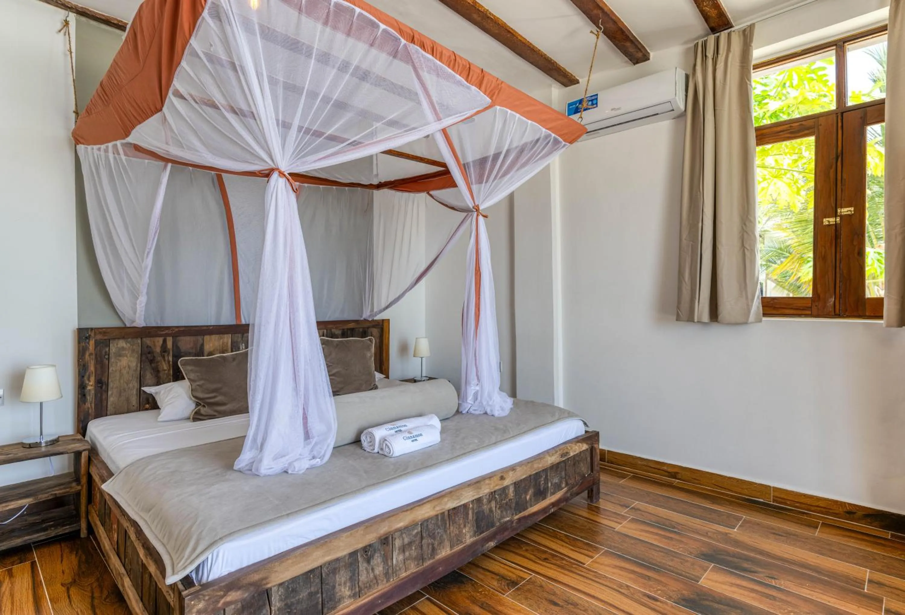 Bed in Cinnamon Hotel