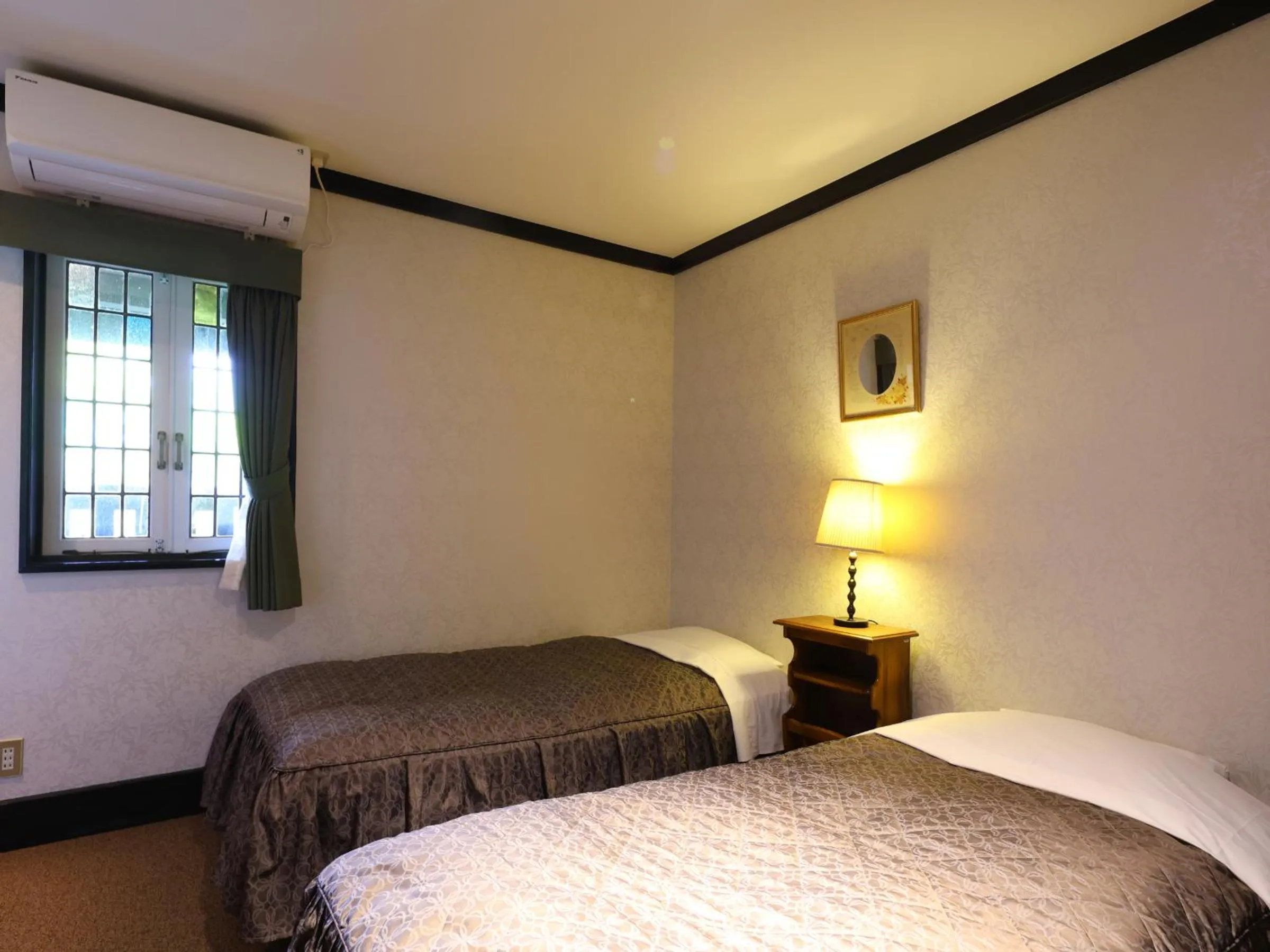 Bed in Petit Hotel & Restaurant Old Age