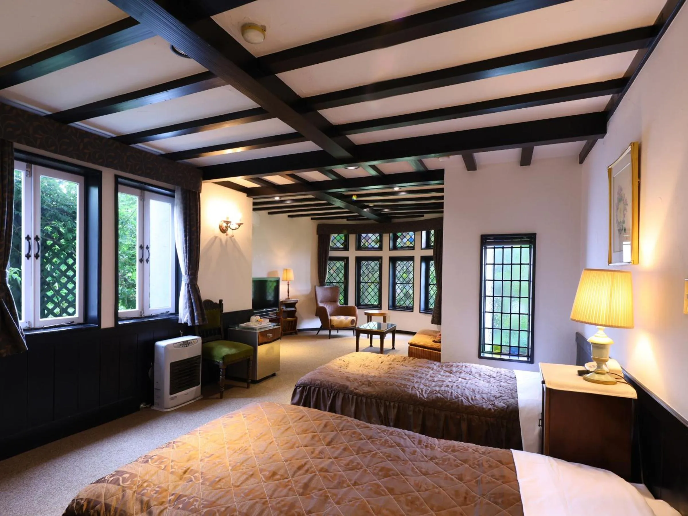 Bed in Petit Hotel & Restaurant Old Age