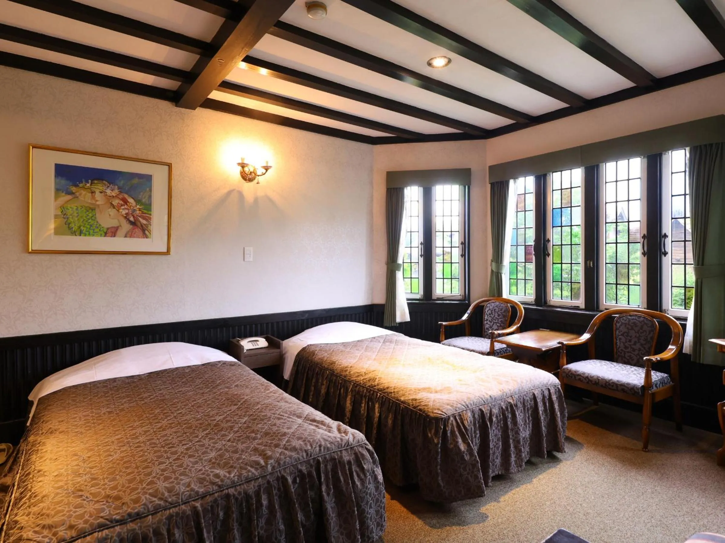 Bed in Petit Hotel & Restaurant Old Age