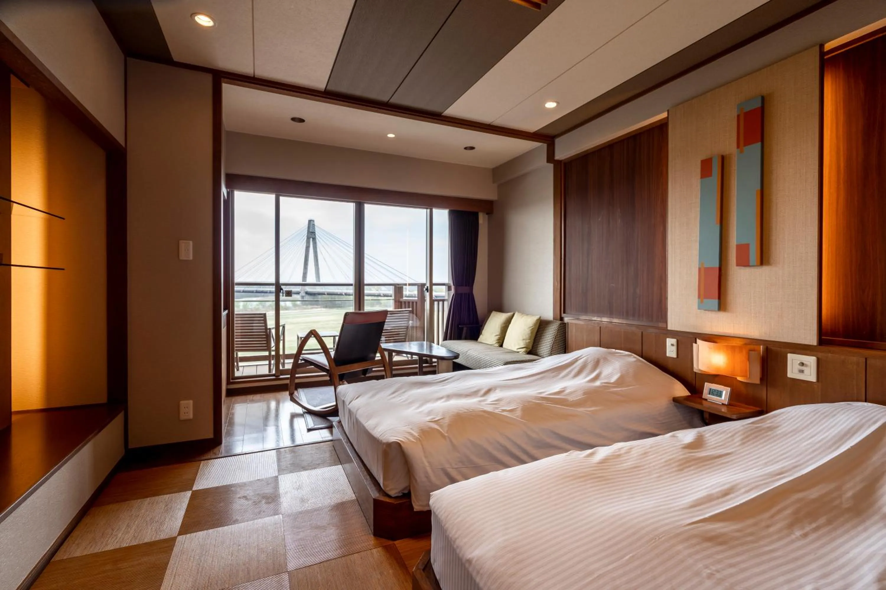 Living room, Bed in Tokachigawa Onsen Daiichi Hotel