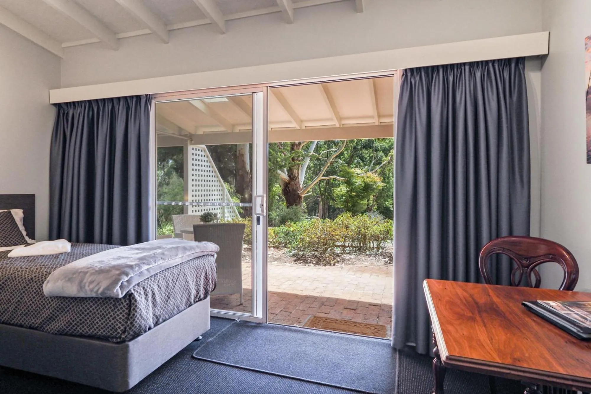 Patio, Bed in Forest Lodge Resort