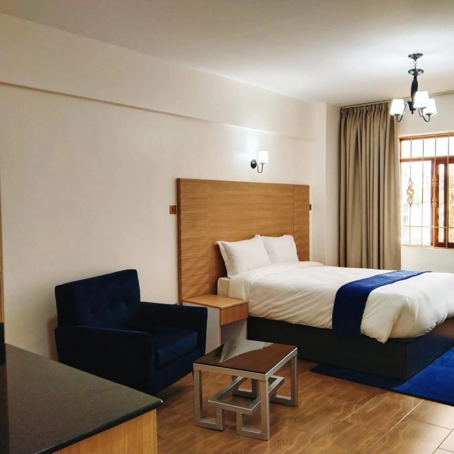 Photo of the whole room, Bed in Hays Suites Hotel