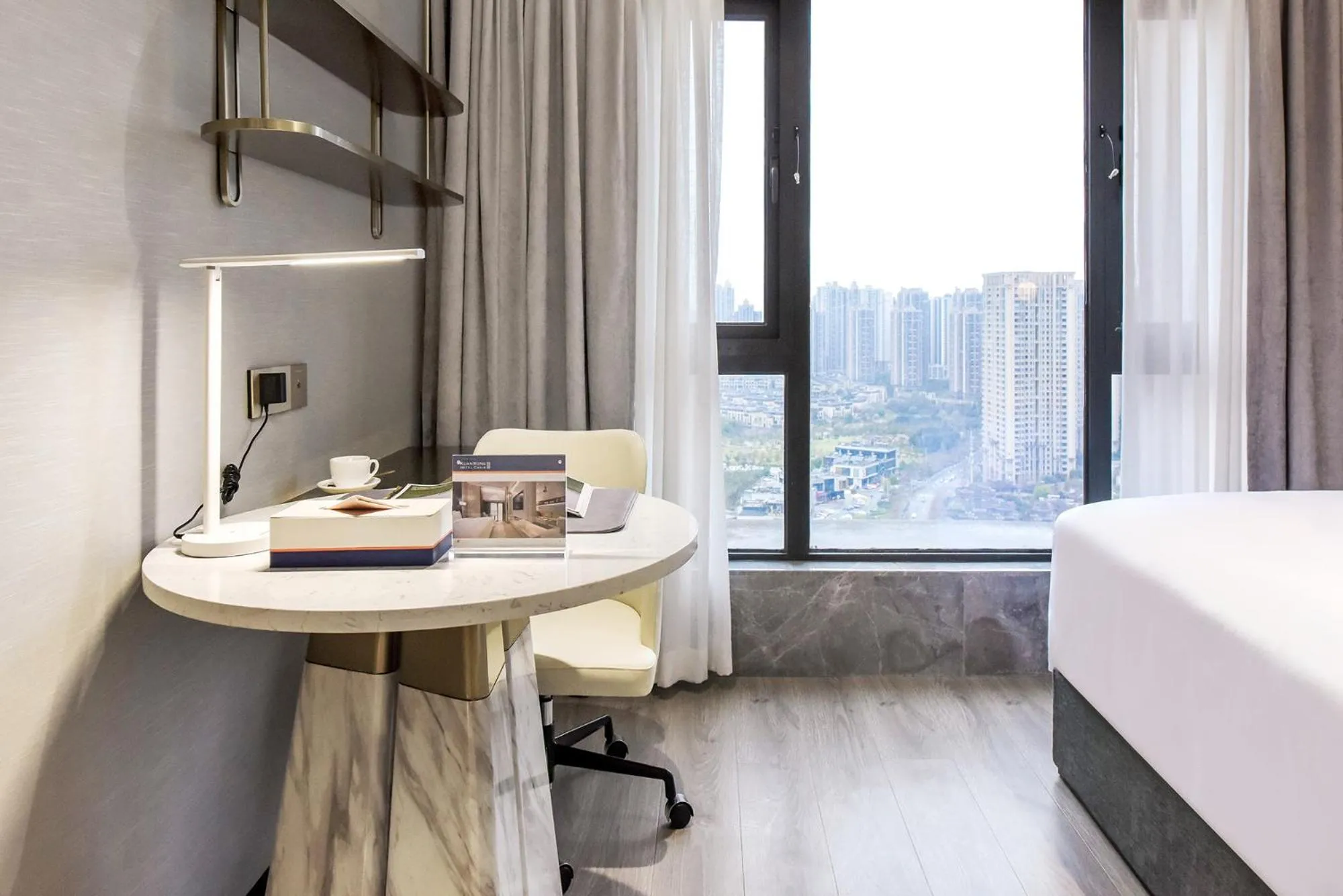 Bedroom in Kuanrong Suites Hotel Liangjiang love sea shopping park