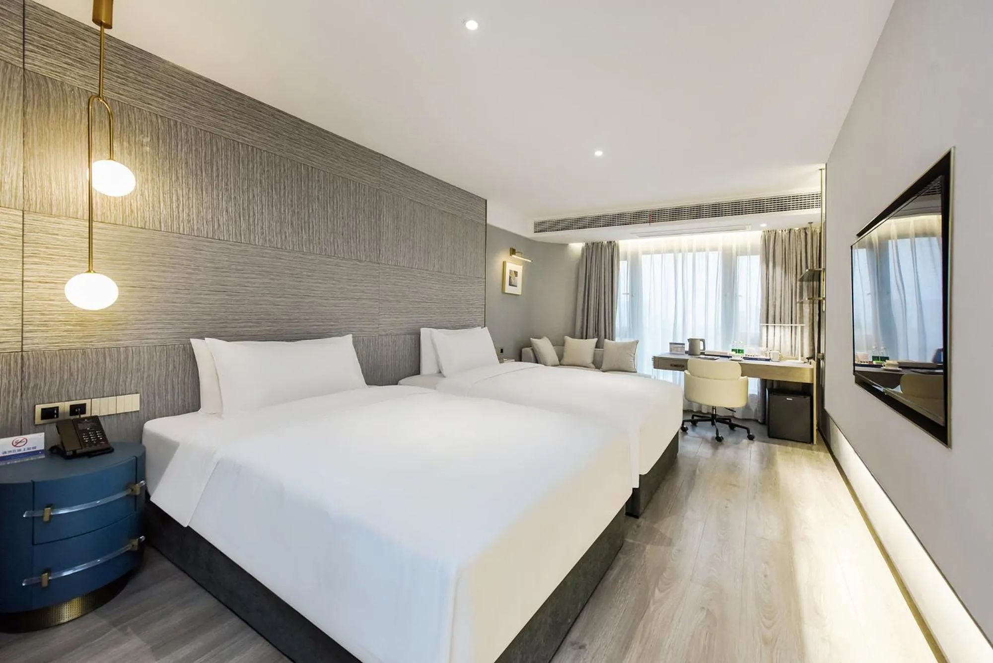 Bedroom in Kuanrong Suites Hotel Liangjiang love sea shopping park