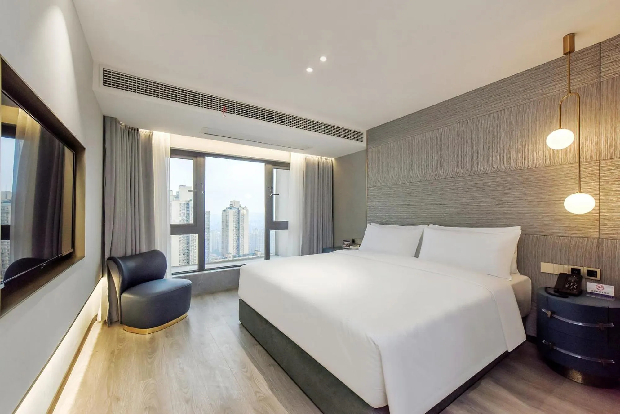 Bed in Kuanrong Suites Hotel Liangjiang love sea shopping park