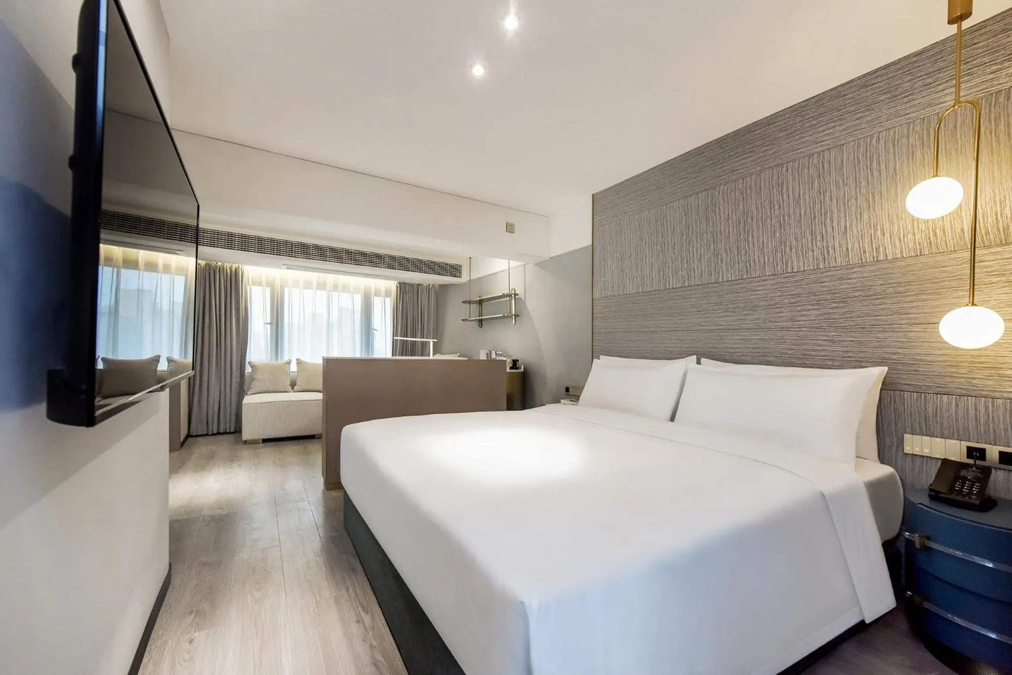 Bedroom in Kuanrong Suites Hotel Liangjiang love sea shopping park