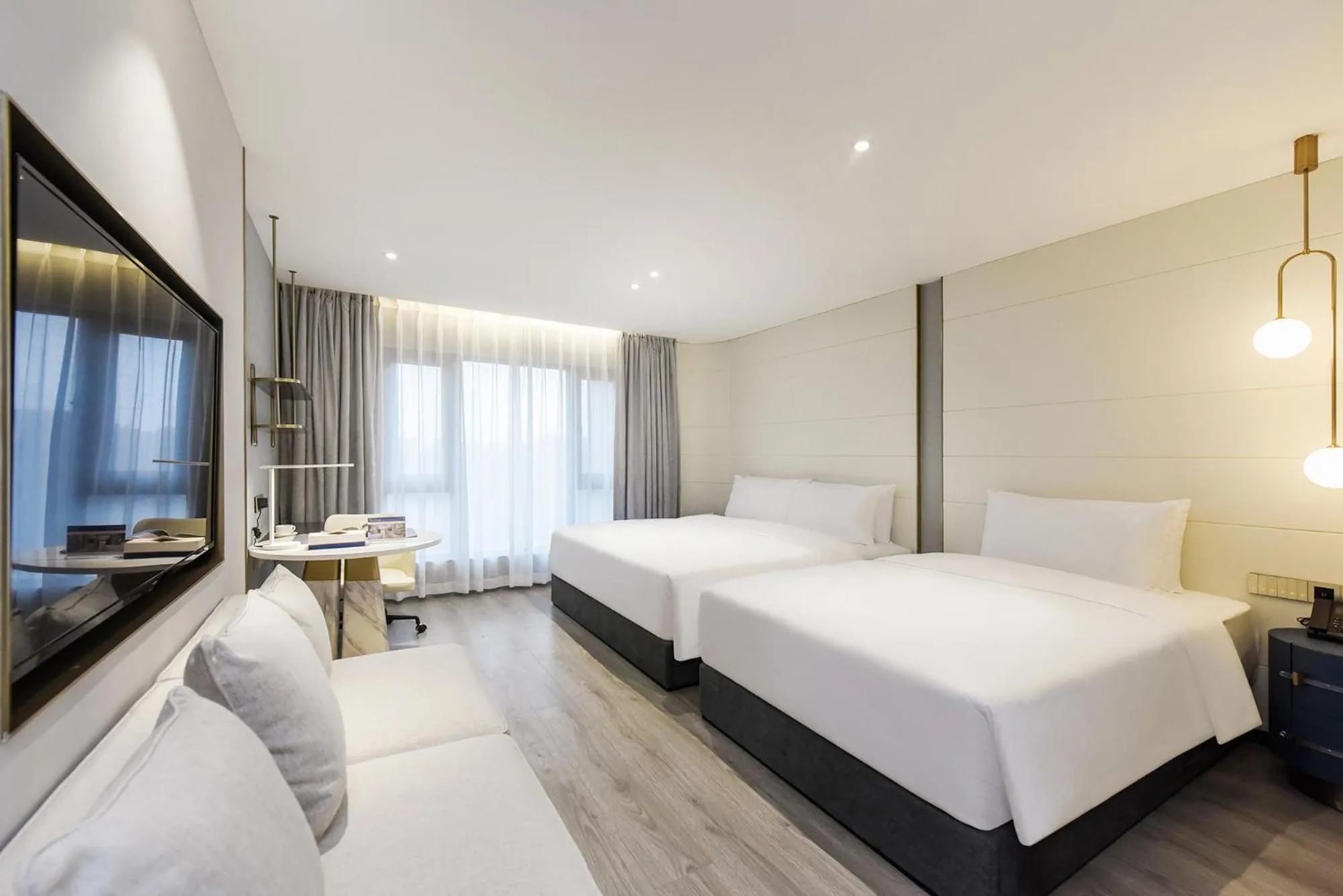 Bedroom in Kuanrong Suites Hotel Liangjiang love sea shopping park