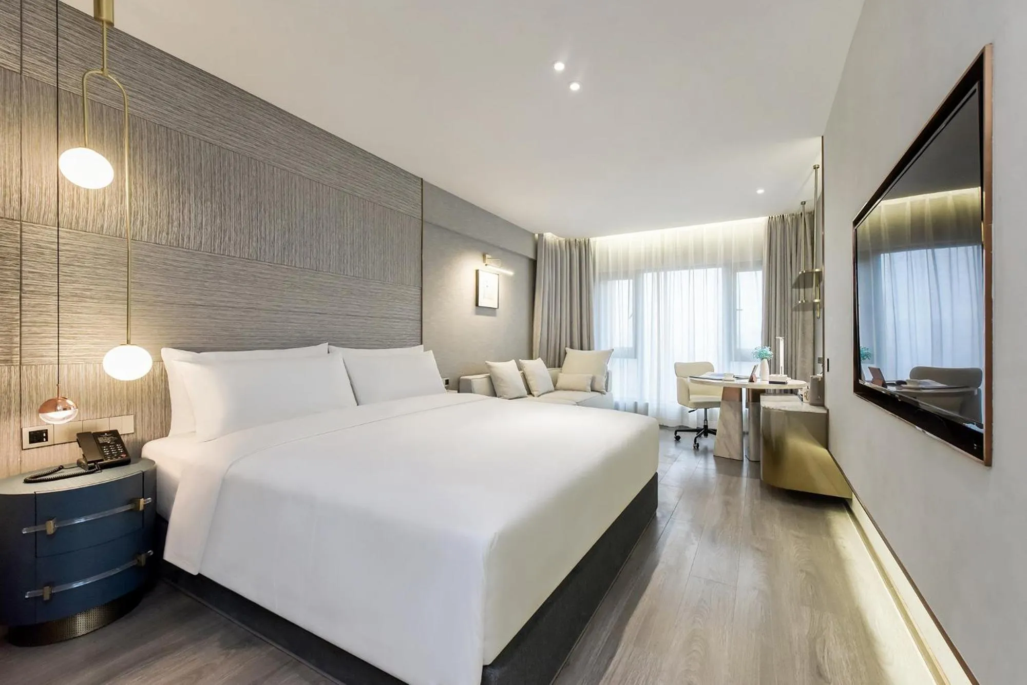 Bedroom in Kuanrong Suites Hotel Liangjiang love sea shopping park