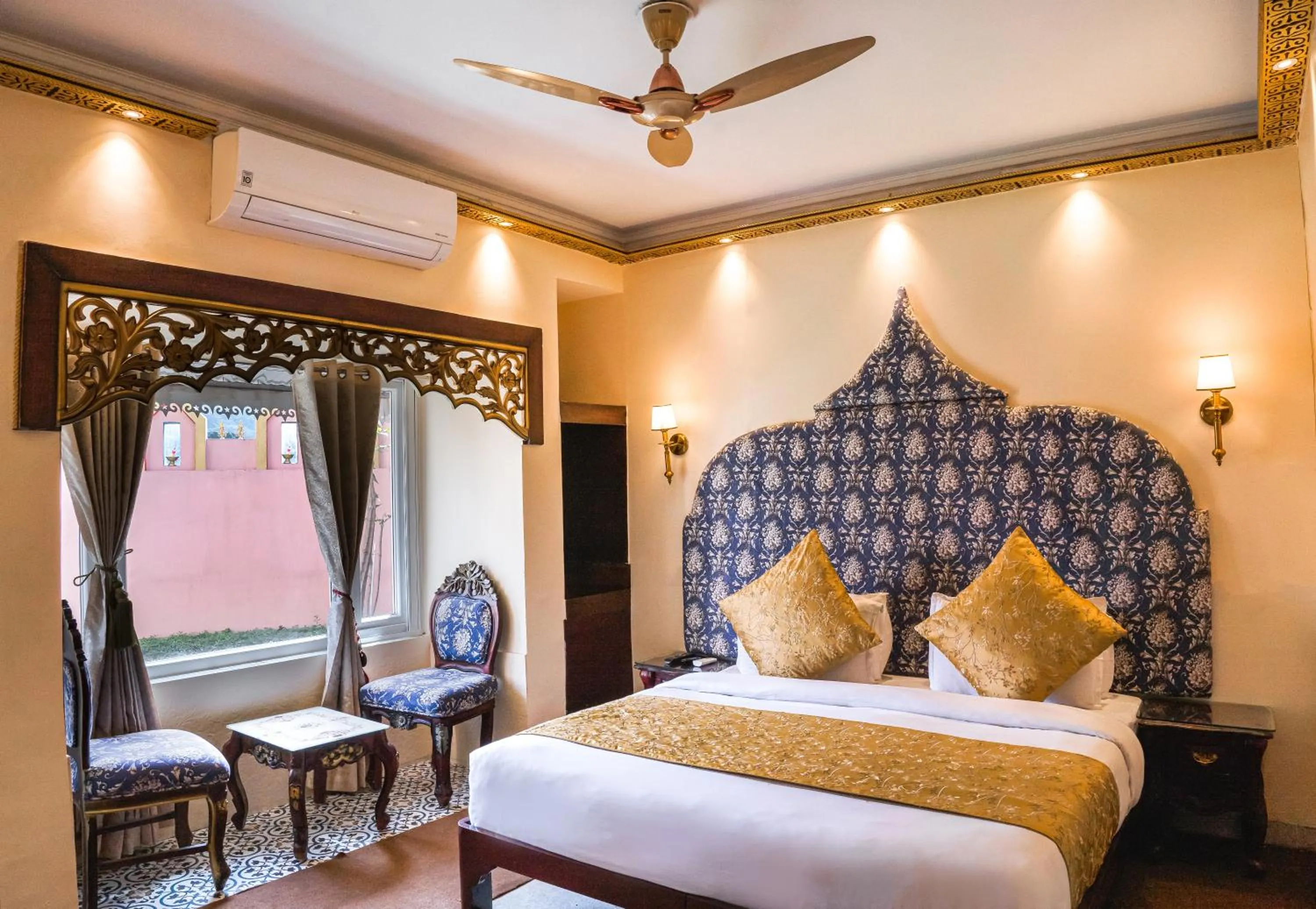 Seating area, Bed in The Neeraj Ganga Heritage Palace