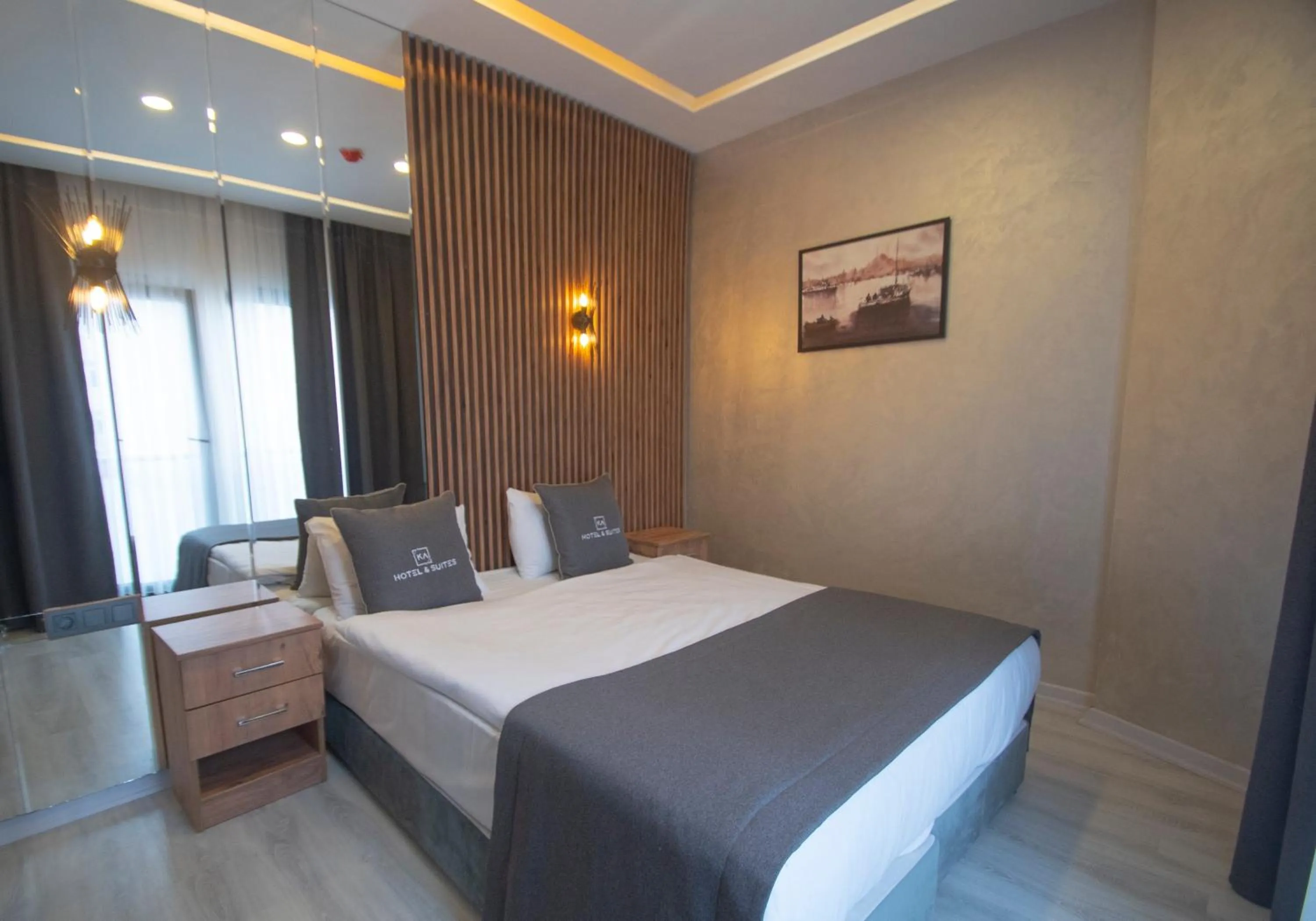 Bed in KA Hotel & Suites