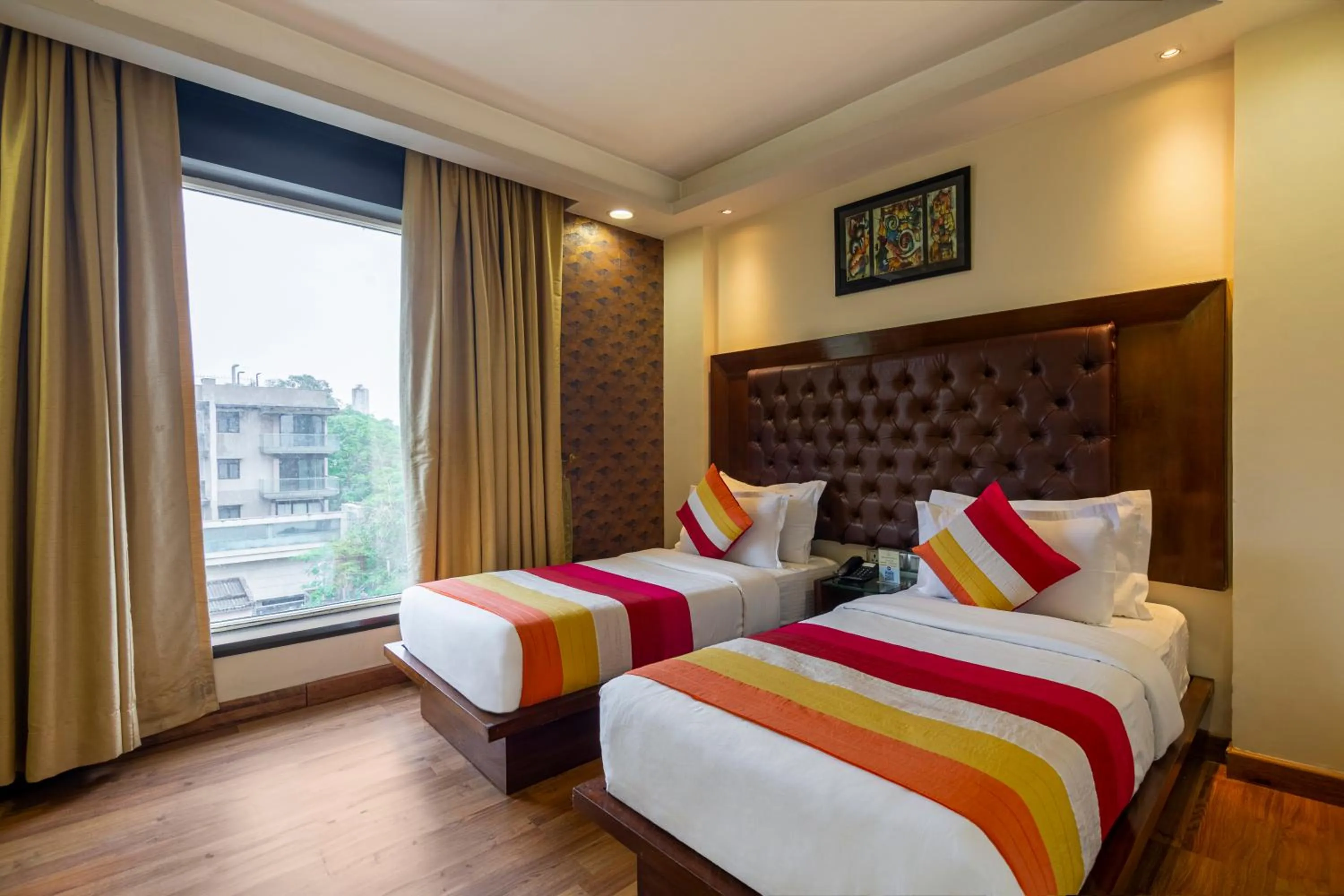 Bed in The Grand Orion - Kailash Colony