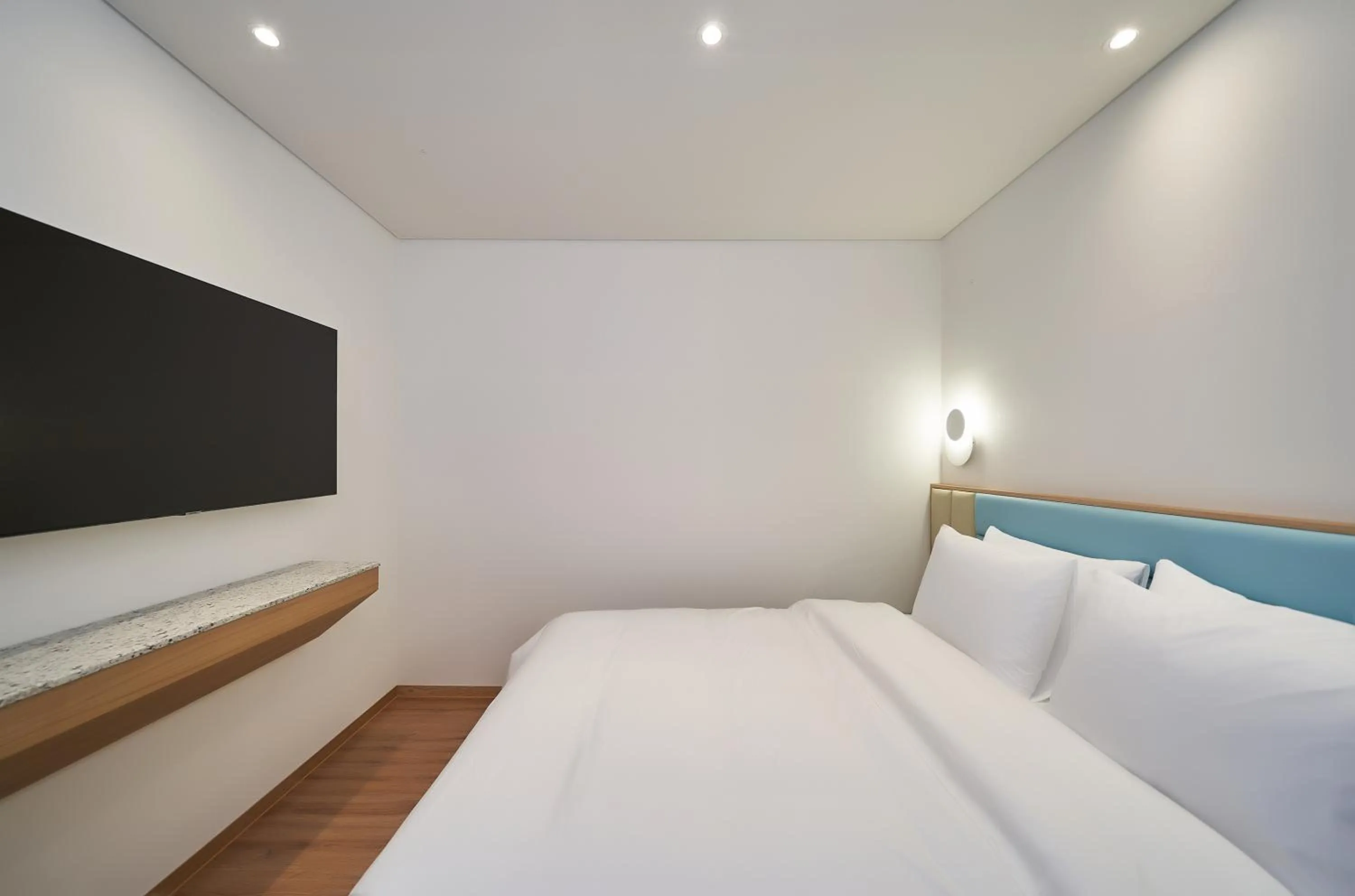 Bed in JN PARK Hotel