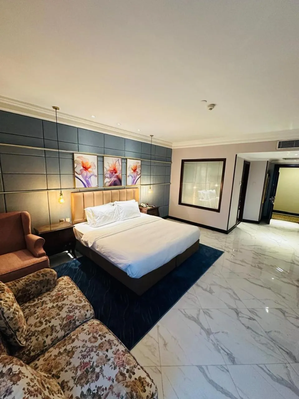 Bed in The Convention Center & Royal Suites Hotel