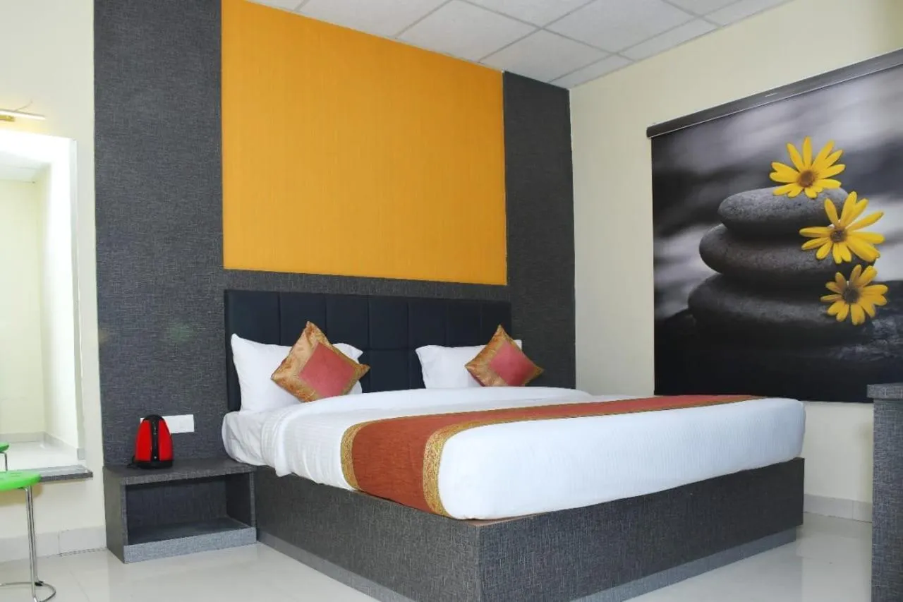 Bed in Hotel Tridev Grand