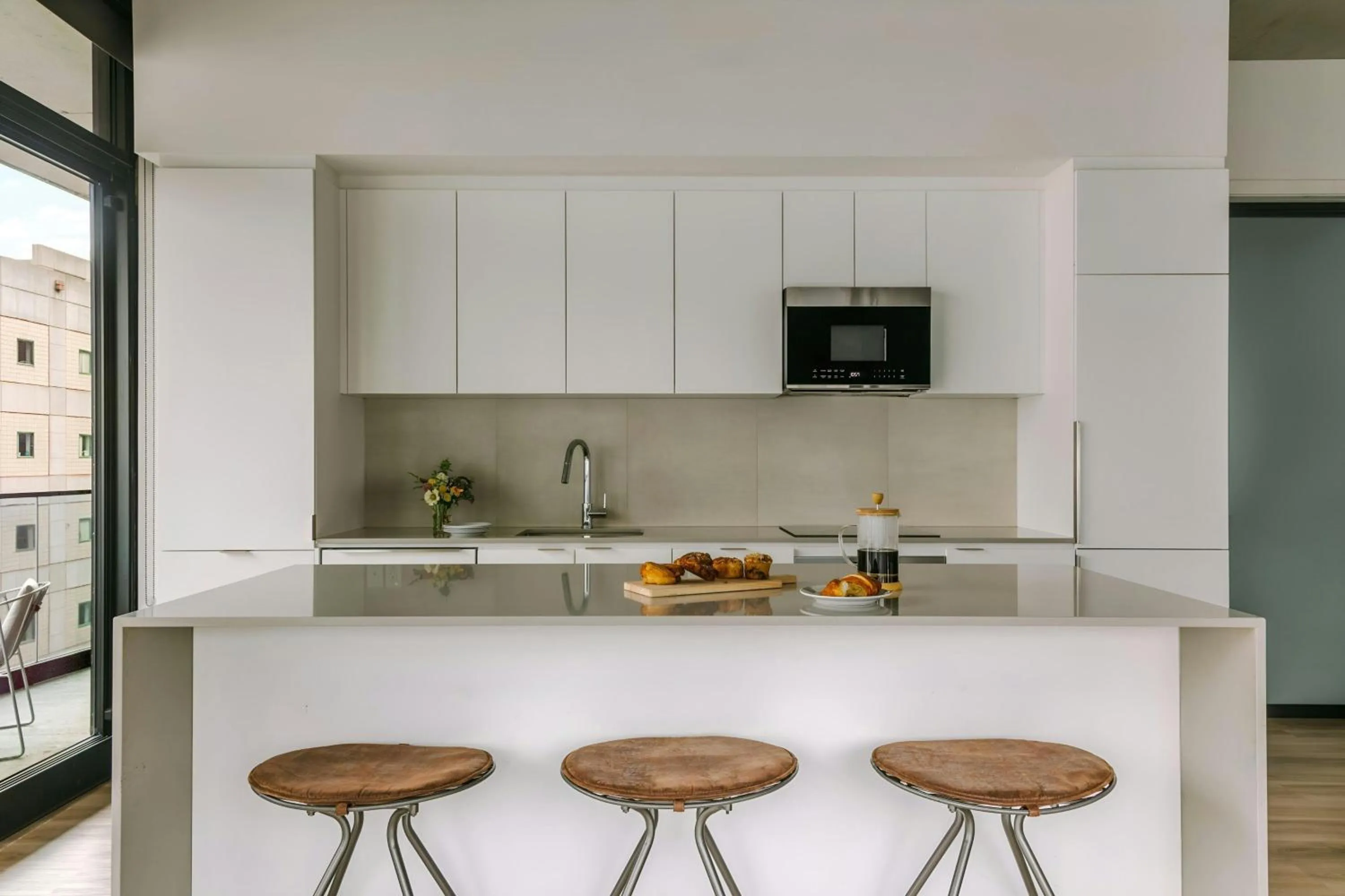 Kitchen or kitchenette in Sonder by Marriott Bonvoy Maisonneuve Apartments Downtown