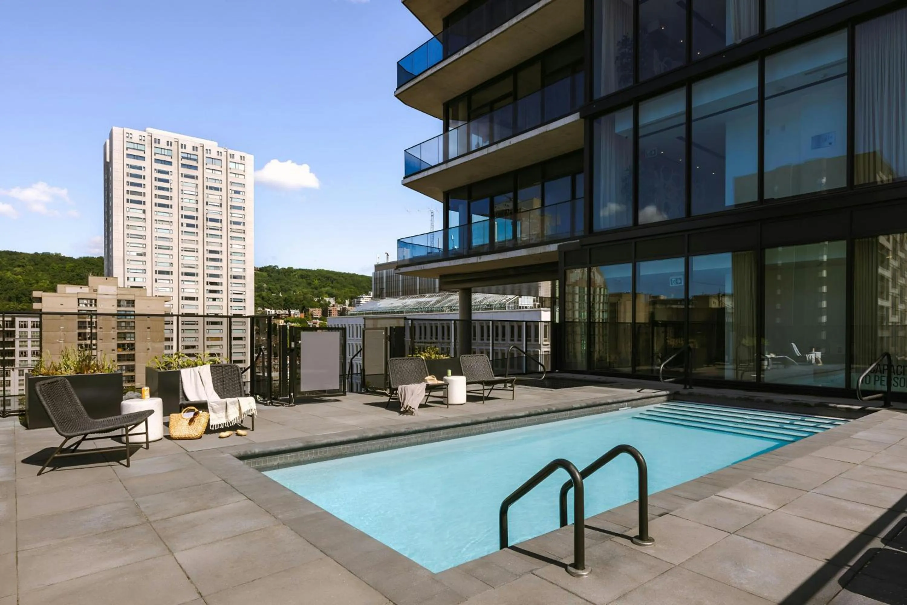 Swimming pool in Sonder by Marriott Bonvoy Maisonneuve Apartments Downtown