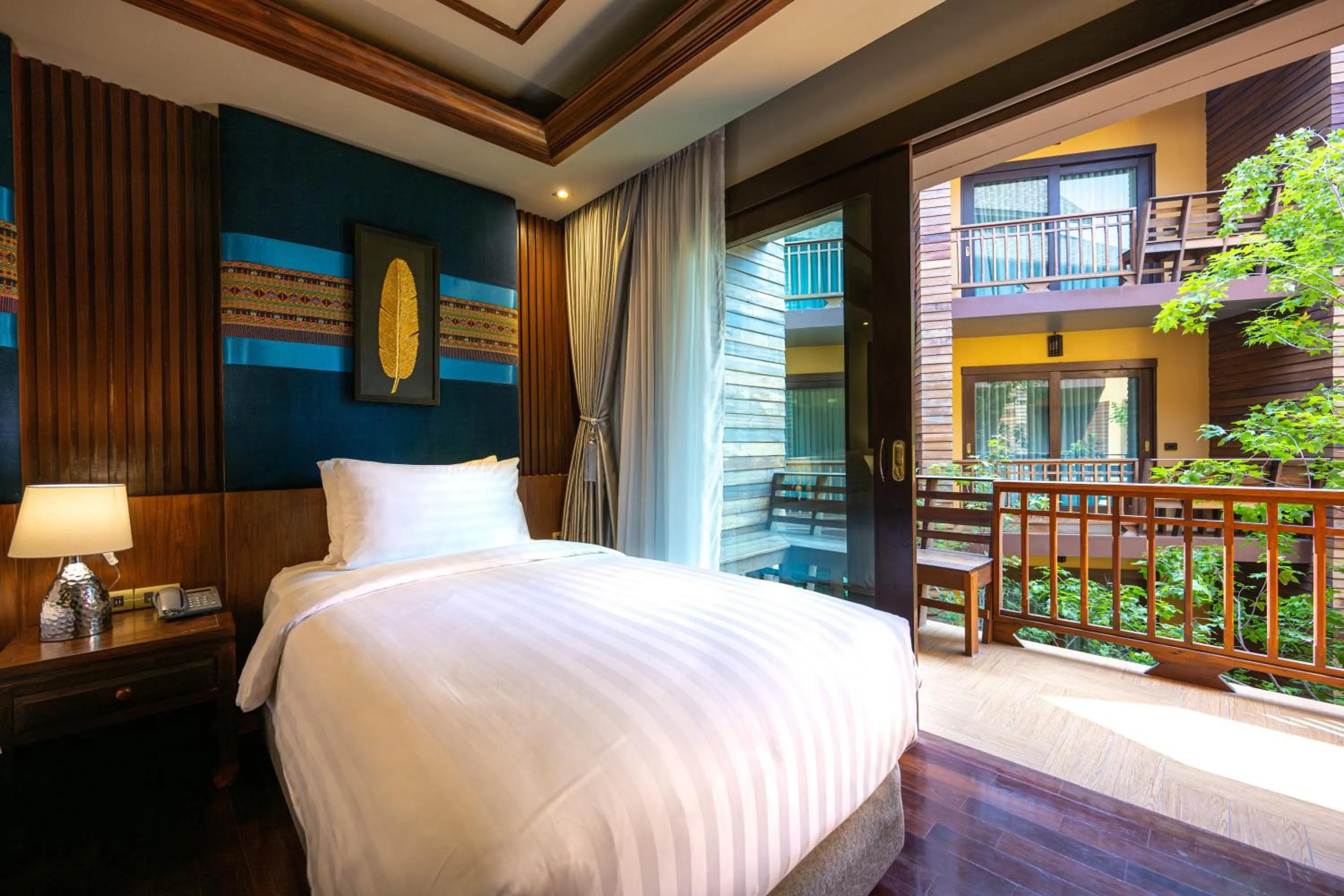 Bed in At Gate Thaphae Hotel