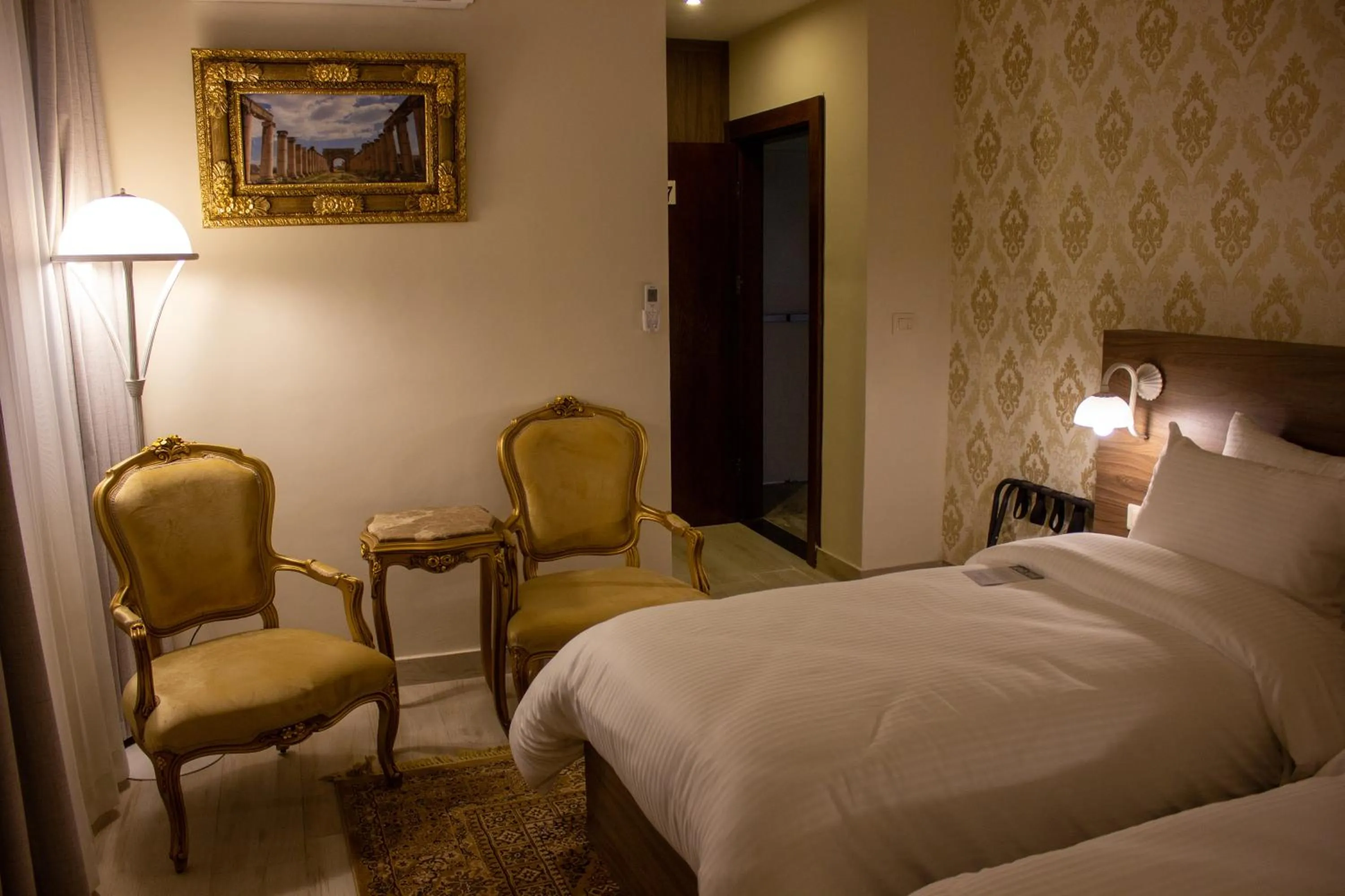 Seating area, Bed in Khan Khediwe Hotel