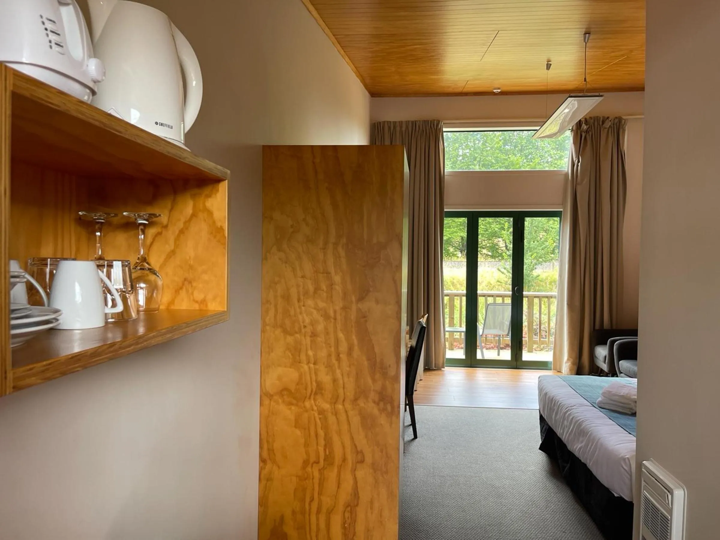 Bed in Waitomo Lodge