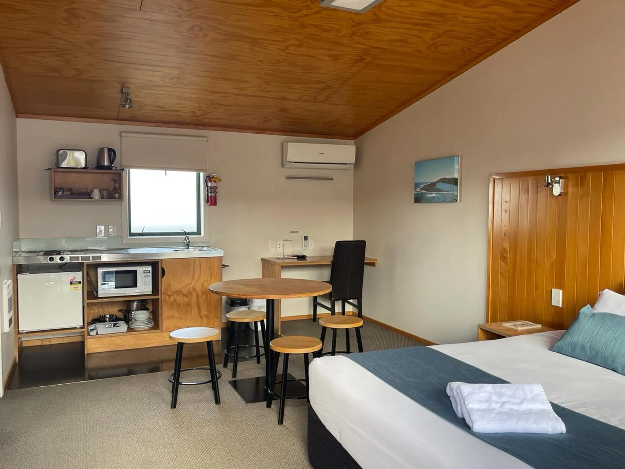 Bed in Waitomo Lodge