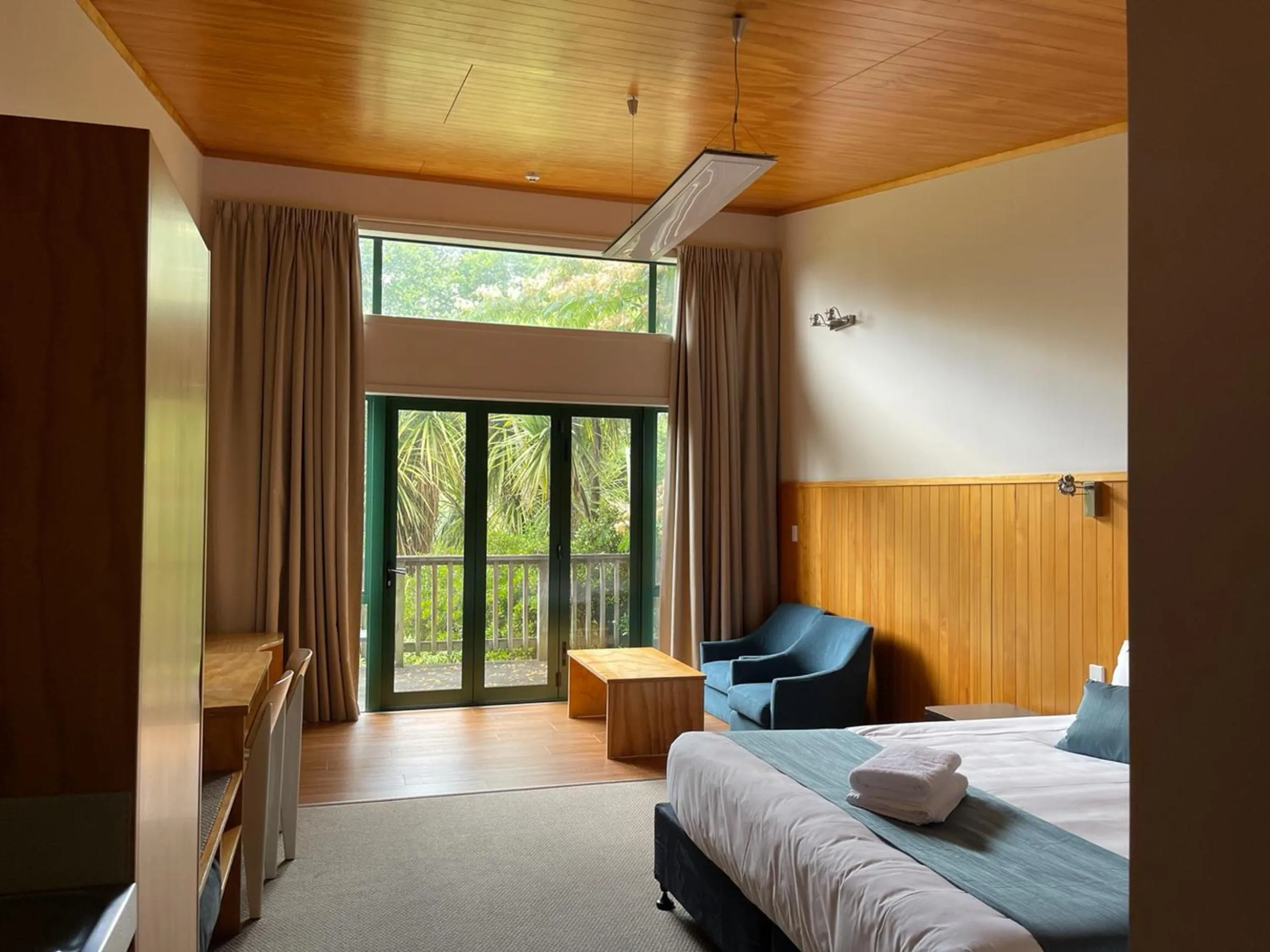 Bed in Waitomo Lodge
