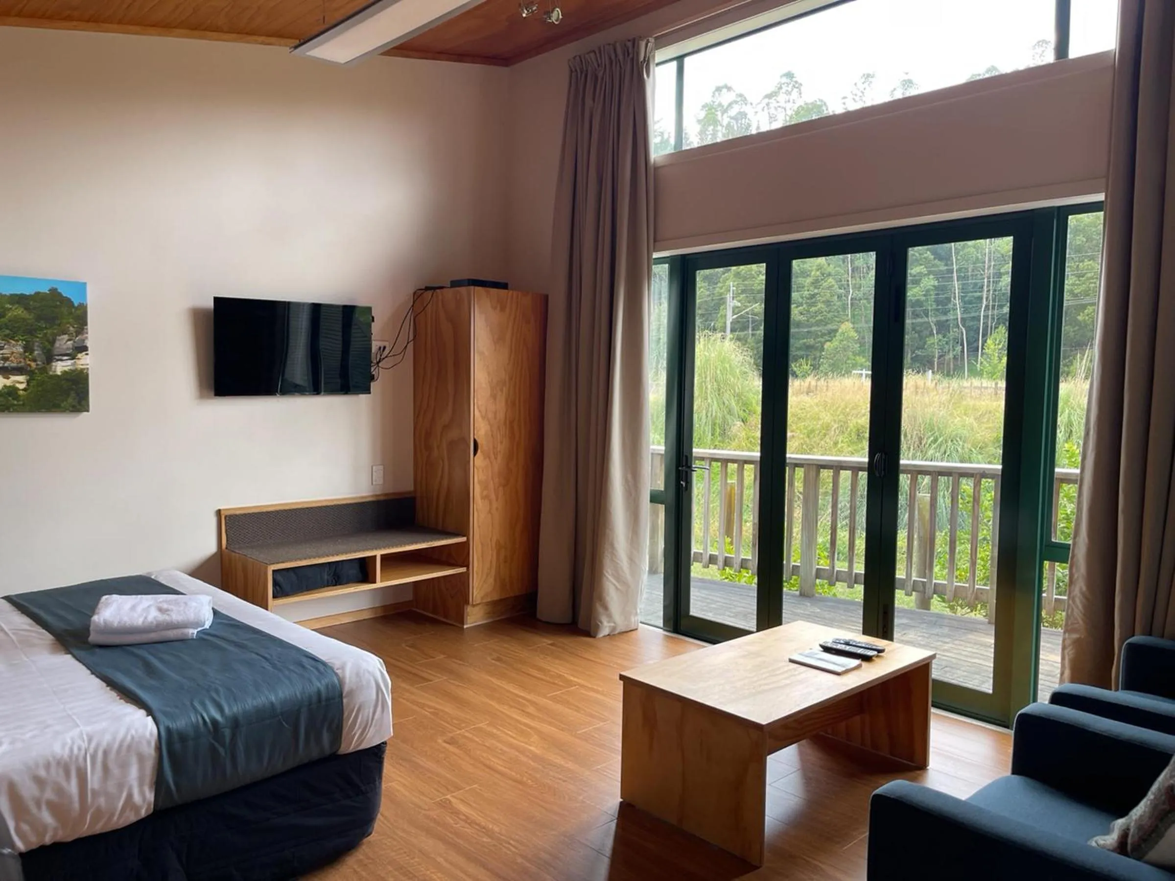 Bed in Waitomo Lodge