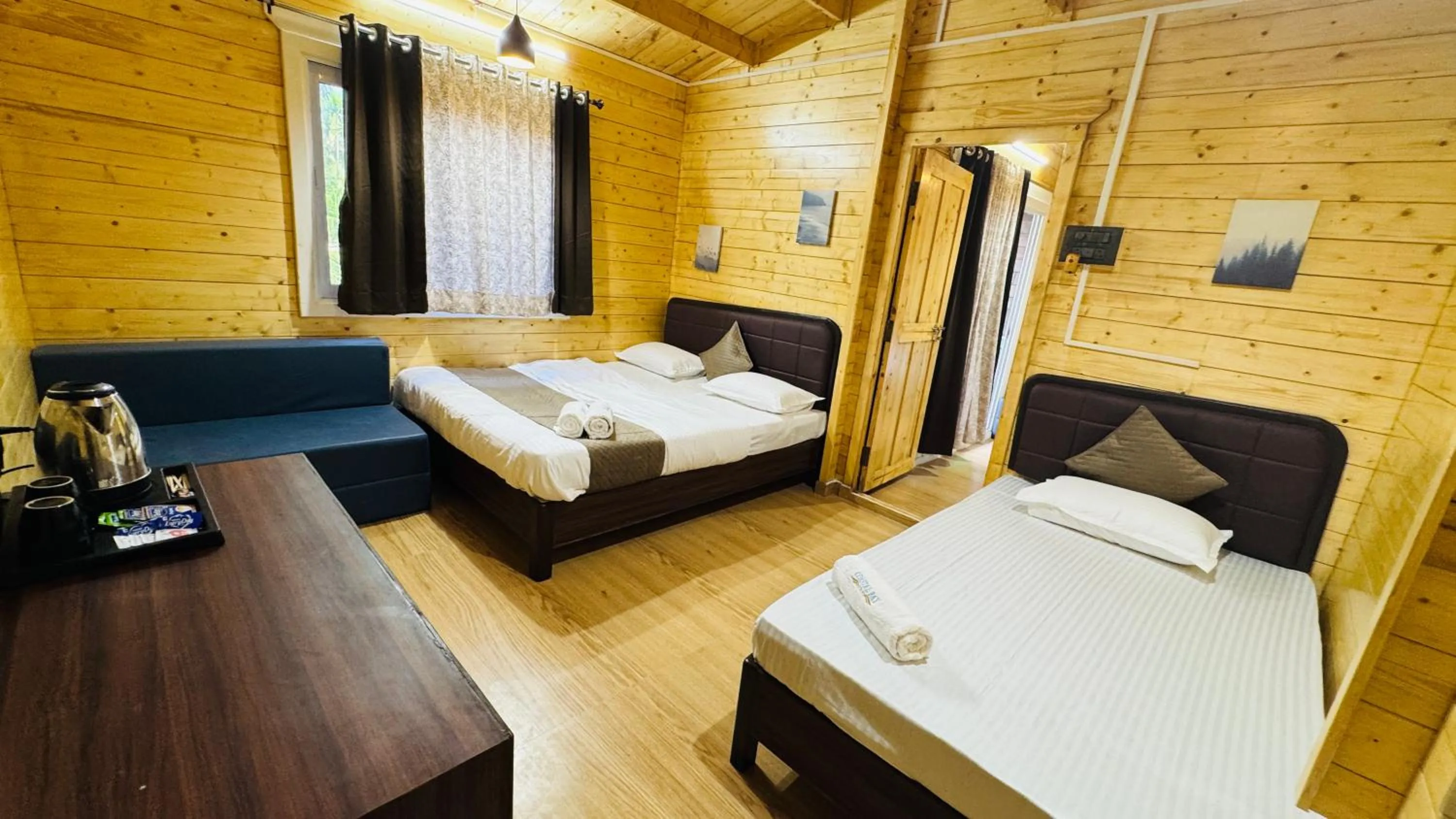 Bed in Coastal Bay Inn by Green Apple Stays