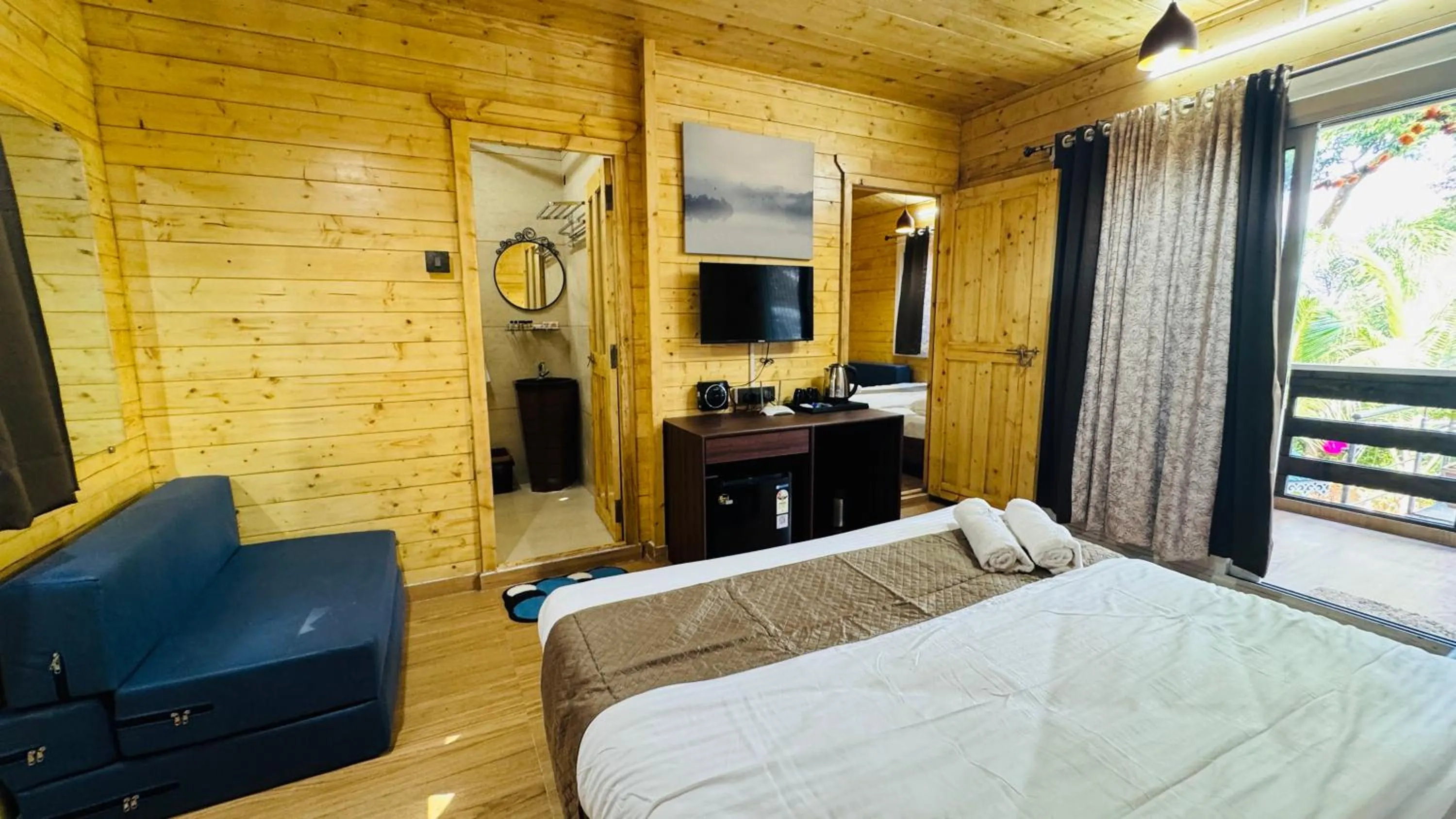 Bed in Coastal Bay Inn by Green Apple Stays