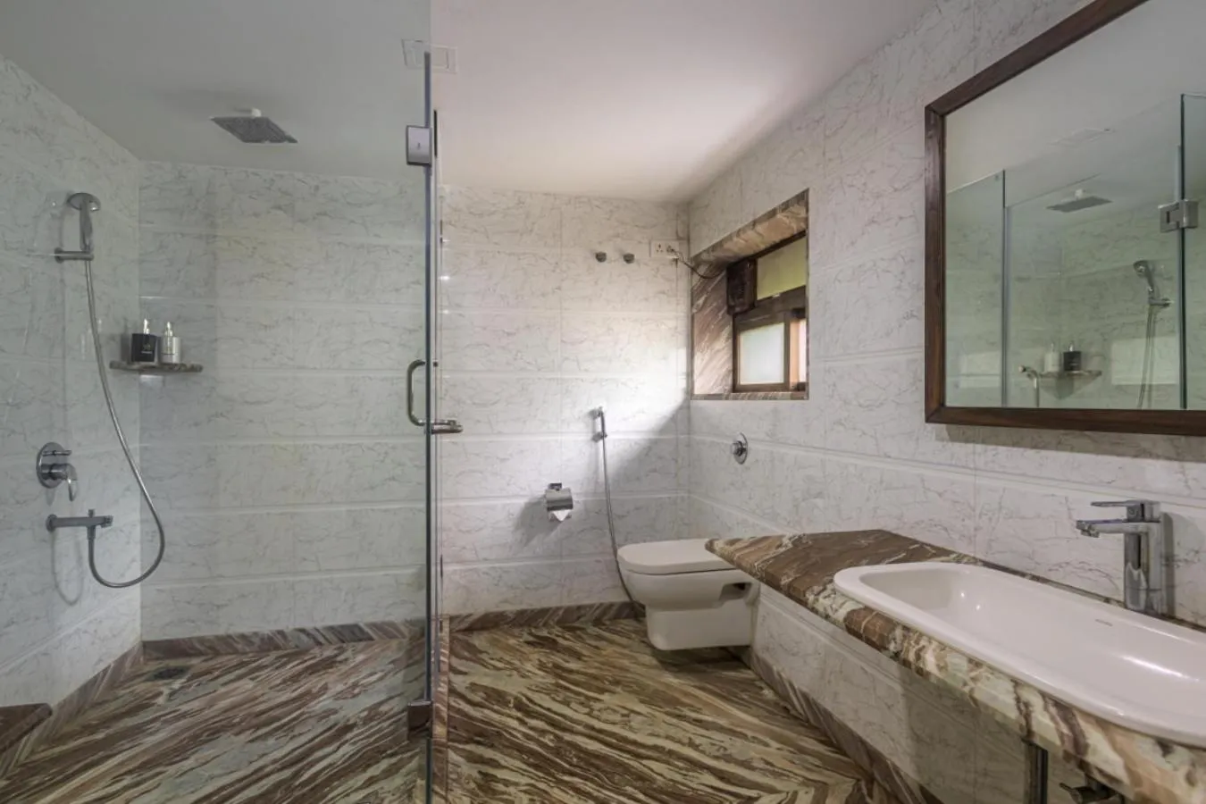 Shower in SaffronStays Aura - 4BR luxury pool villa with gym, BBQ deck, lawns & indoor games near Kihim Beach