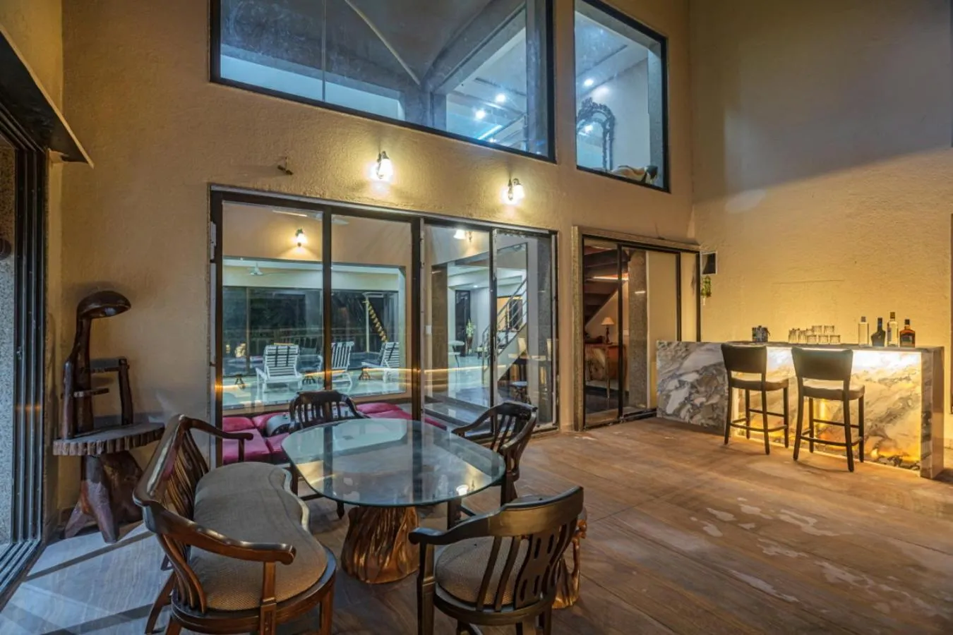 Night in SaffronStays Aura - 4BR luxury pool villa with gym, BBQ deck, lawns & indoor games near Kihim Beach