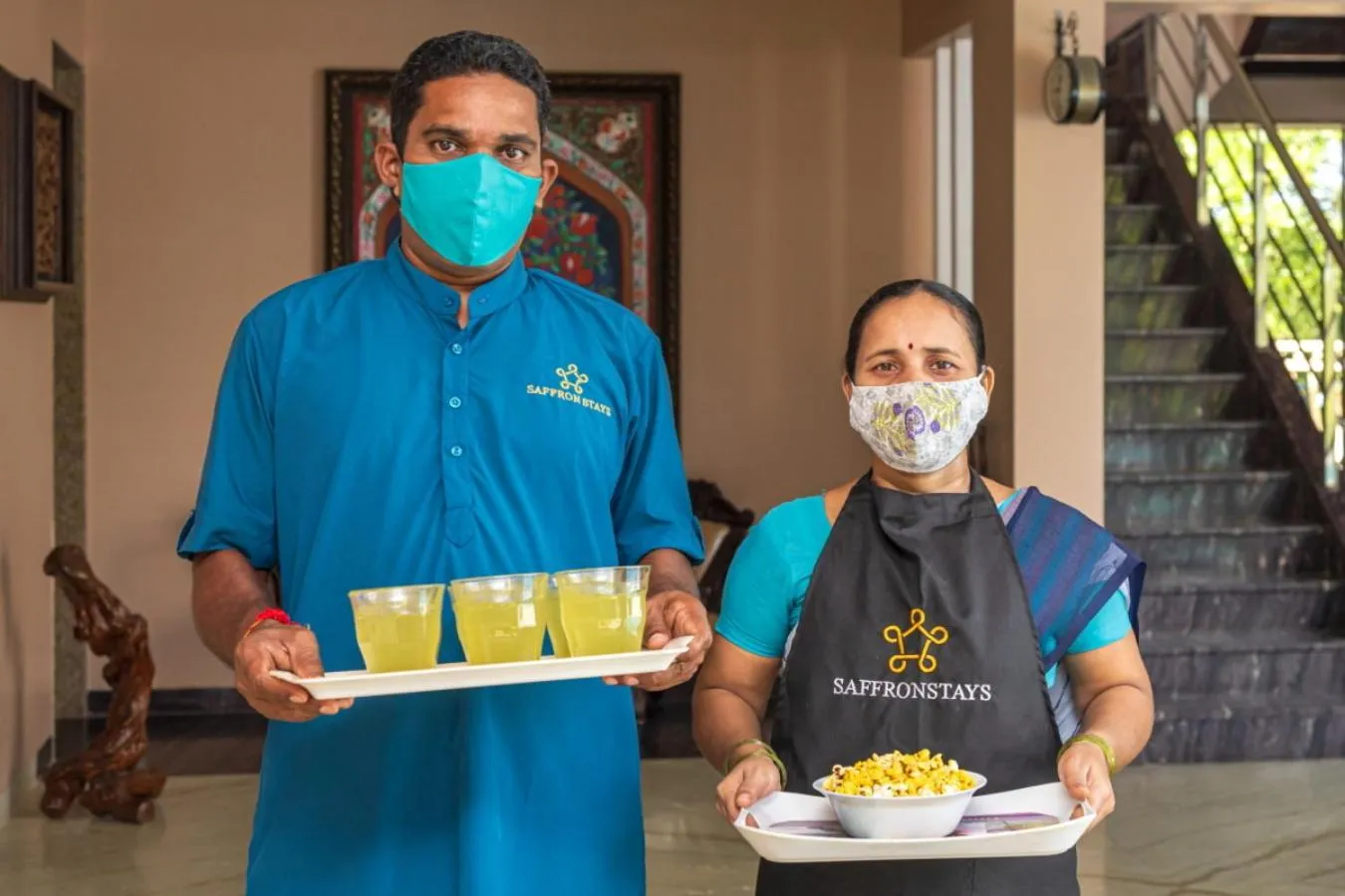 Staff in SaffronStays Aura - 4BR luxury pool villa with gym, BBQ deck, lawns & indoor games near Kihim Beach