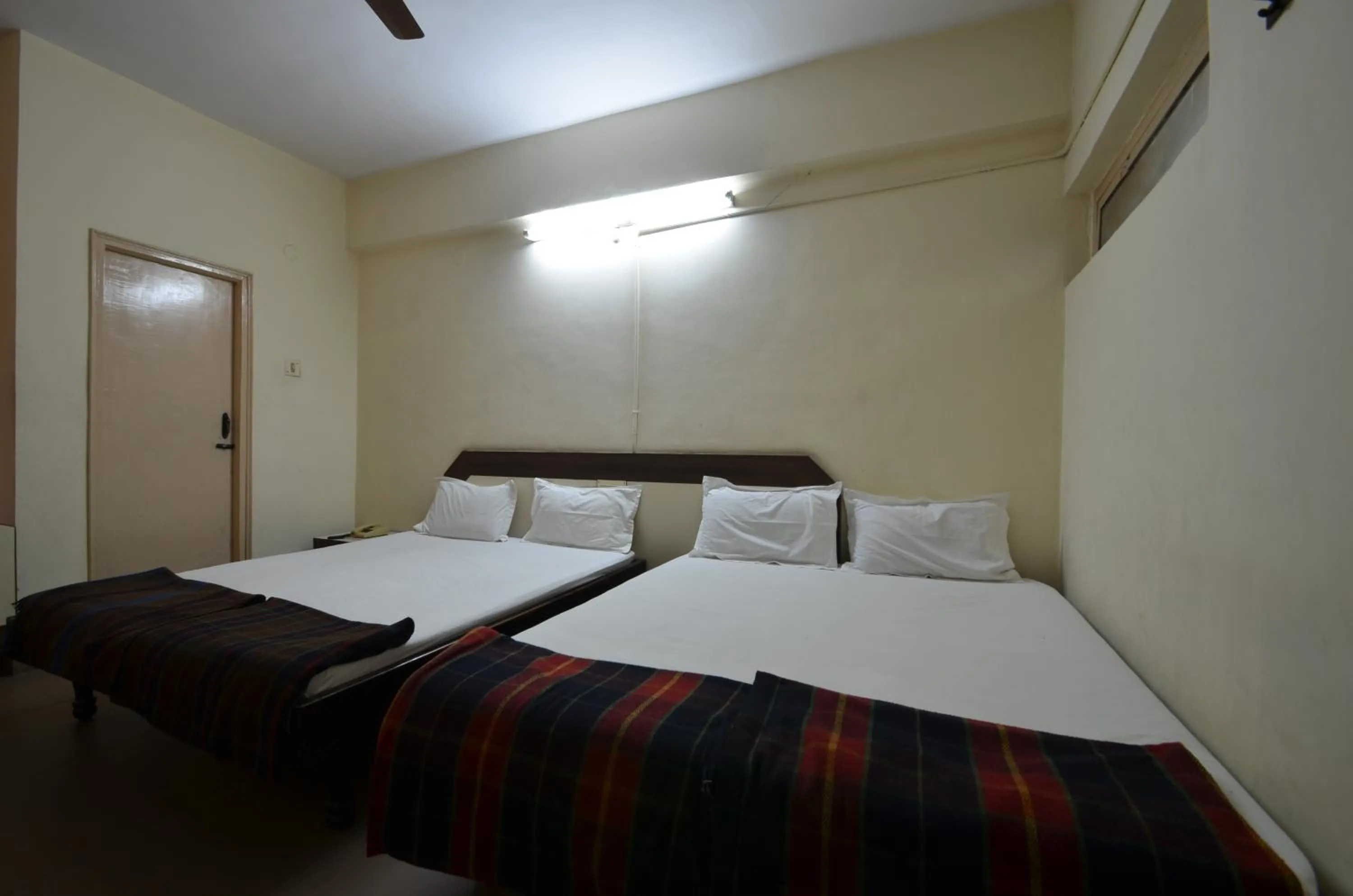 Bed in Hotel Maya Deluxe