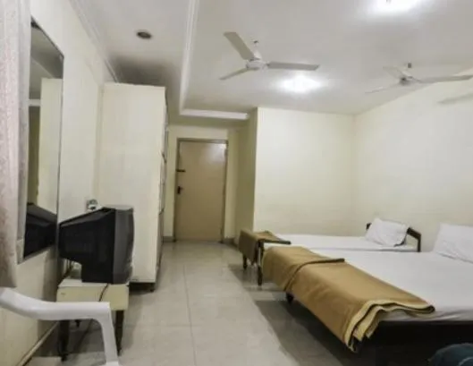 Bed in Hotel Maya Deluxe