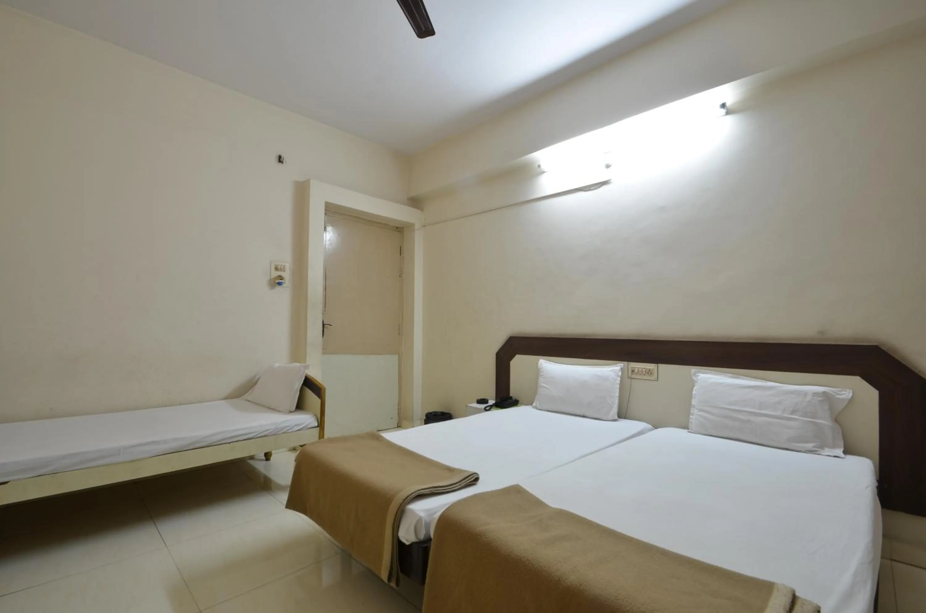 Bed in Hotel Maya Deluxe