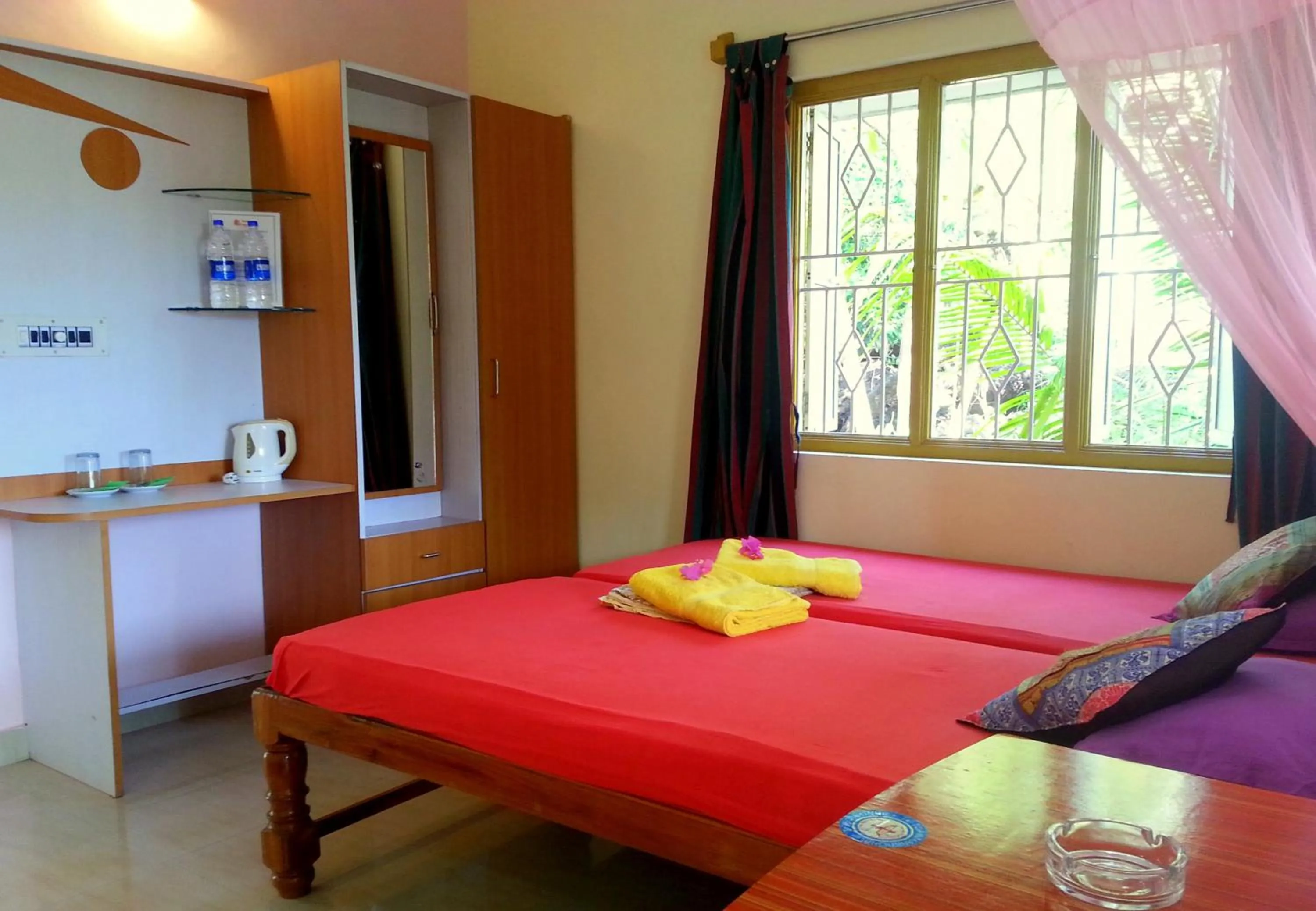 Photo of the whole room, Bed in Namaste Yoga Farm