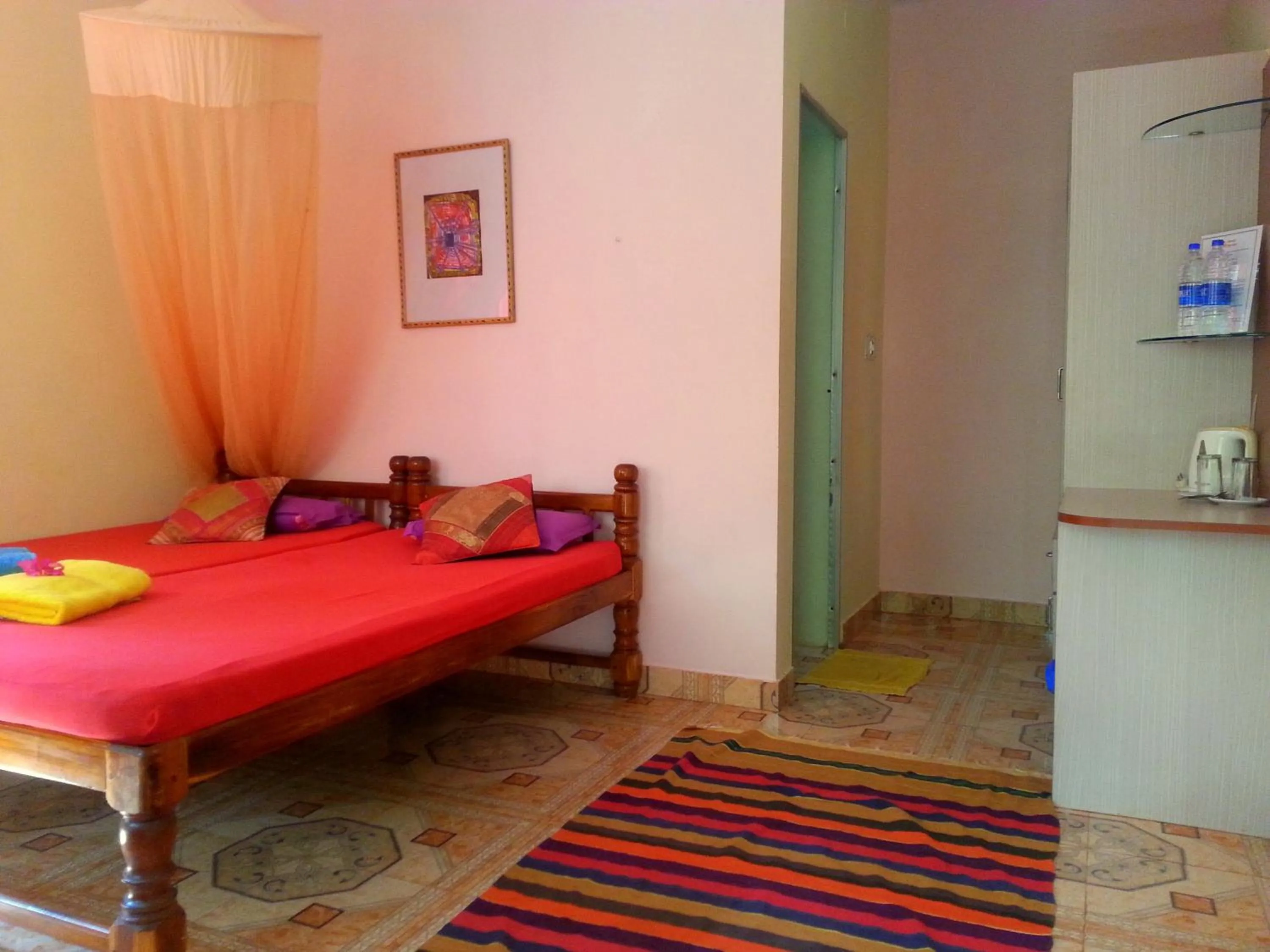 Photo of the whole room, Bed in Namaste Yoga Farm