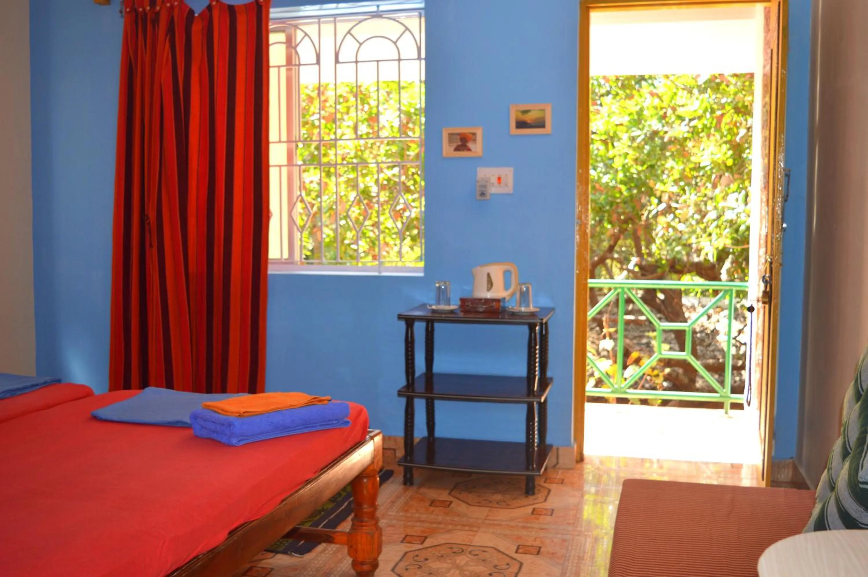 Photo of the whole room, Bed in Namaste Yoga Farm