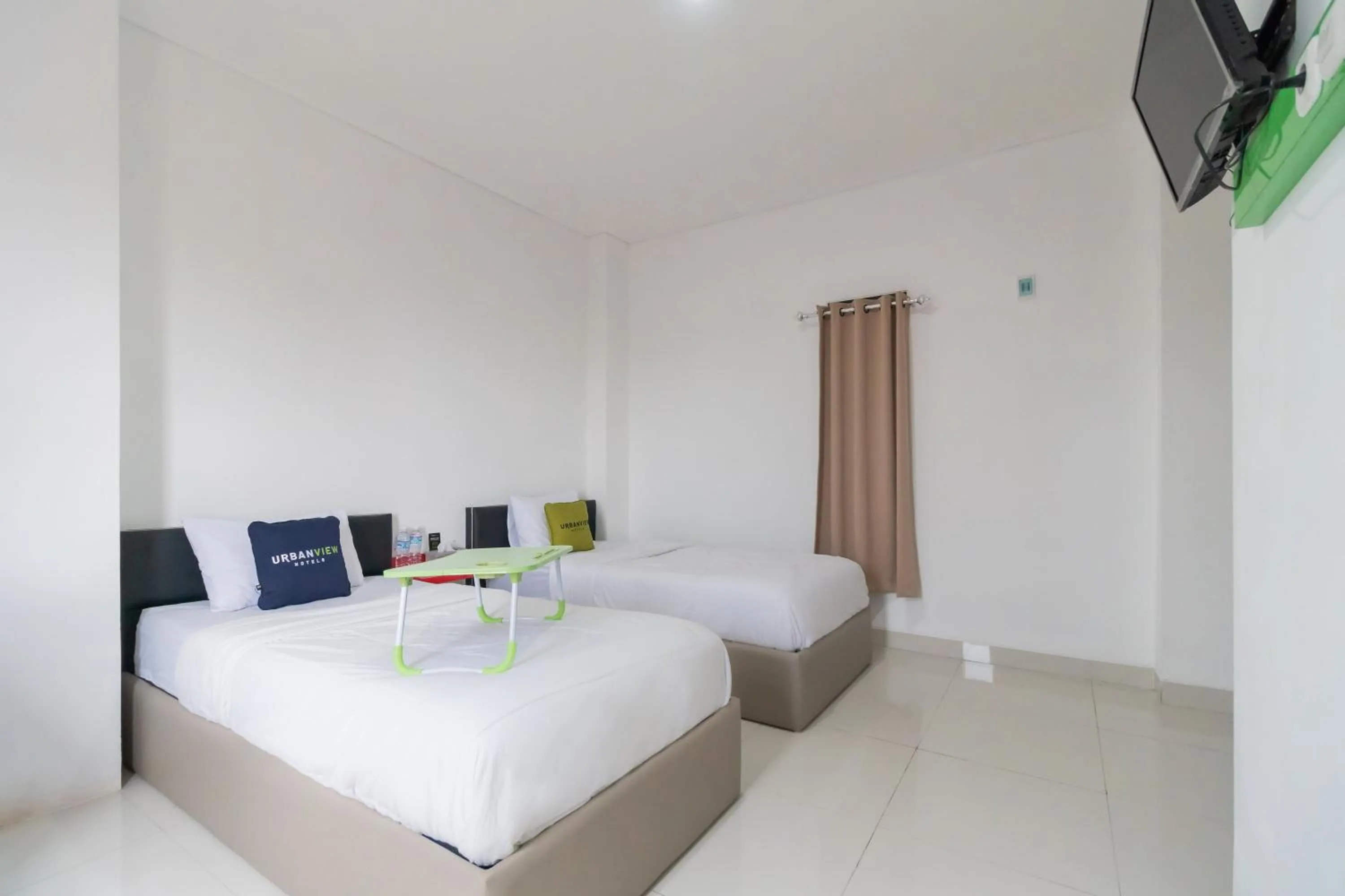 Photo of the whole room, Bed in Urbanview Hotel Ephe Palembang by RedDoorz