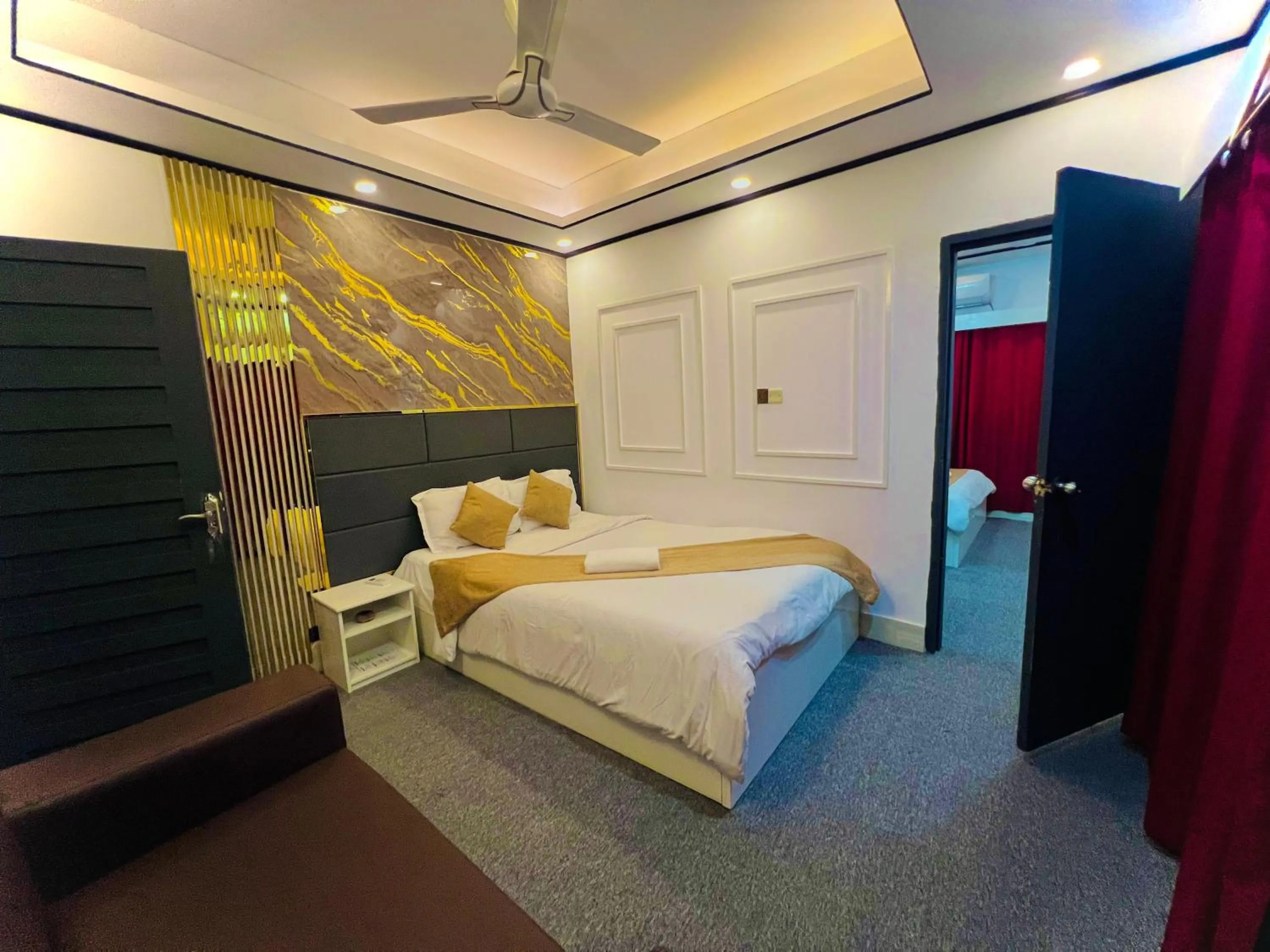 Bed in The Grand Mafi Hotel & Spa